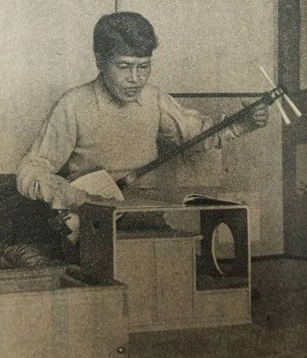  Yoshiya in 1947 playing the shamisen 