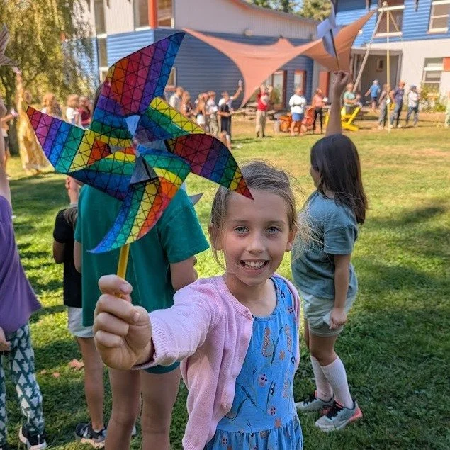 On Friday, our school community came together to celebrate International Day of Peace.  We made pinwheels together and sang a verse of &quot;Peace Like A River.&quot; The wind came blowing through, and everyone's pinwheels began spinning round and ro