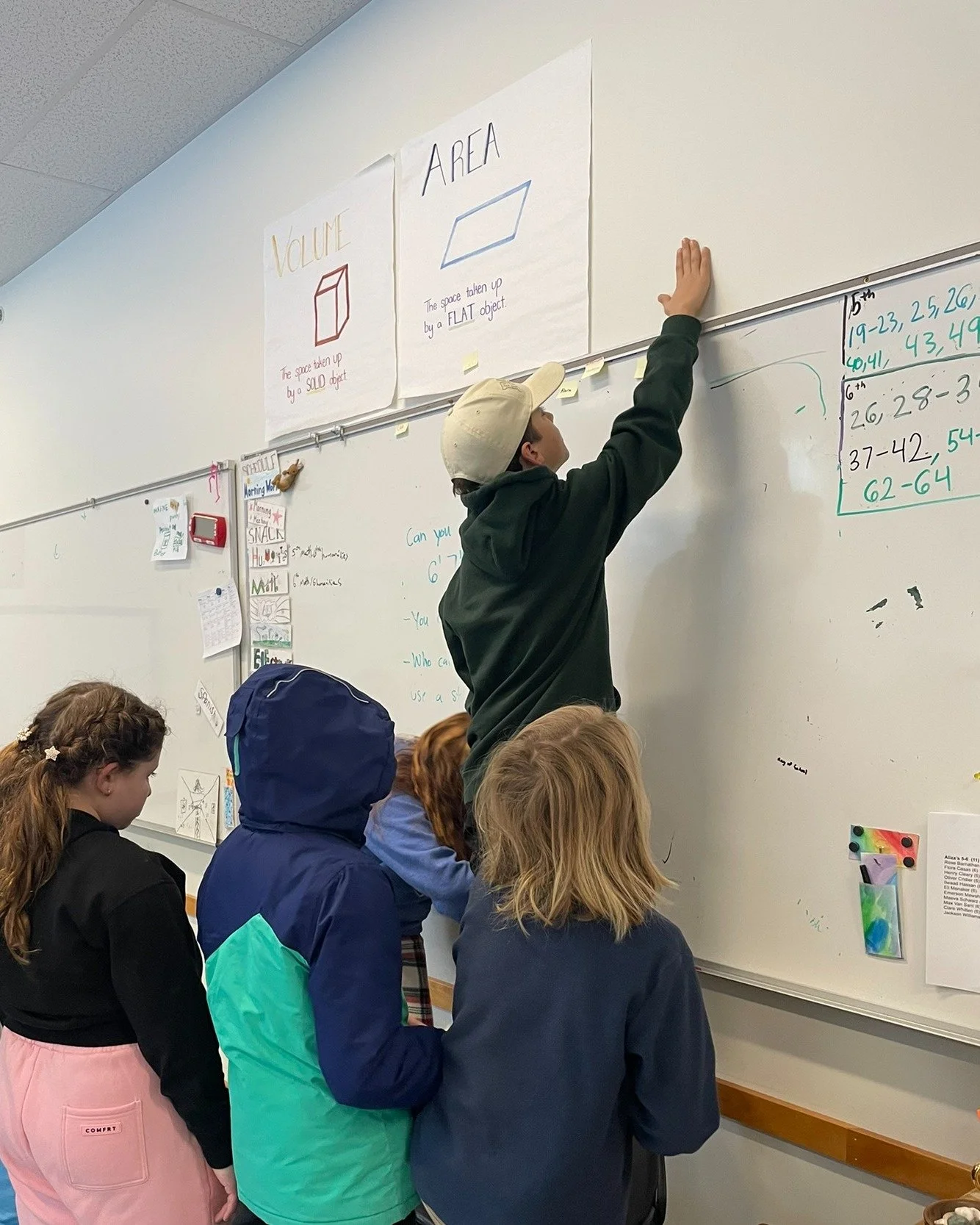 On Friday, to celebrate the 67th day of school, fifth and sixth-grade students wrapped up the week with a lively math challenge: creating as many equations as possible that equal 67. 

Students estimated the length and height of 6 feet 7 inches.  And