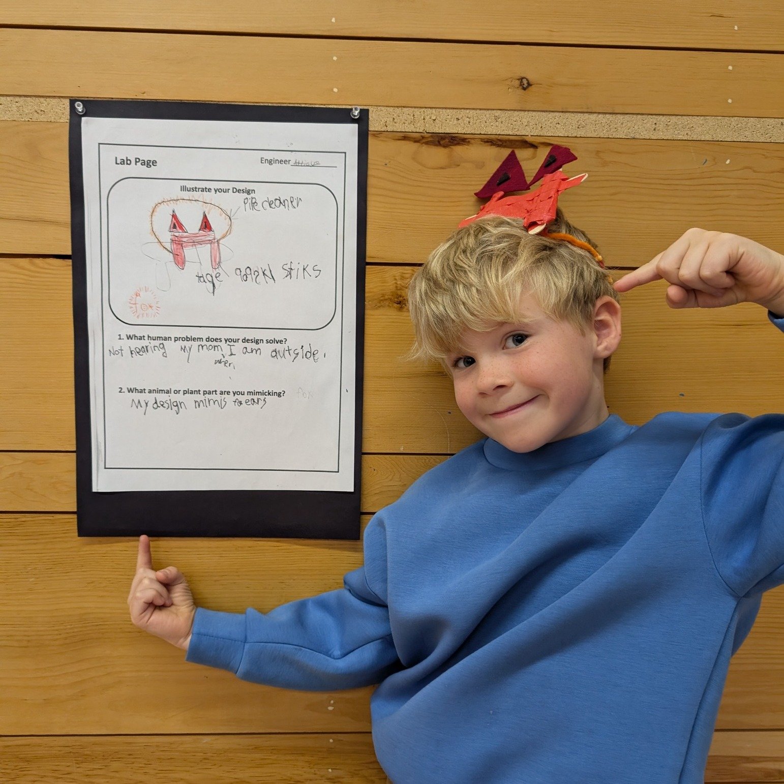 "I don't hear my mom calling me inside when I'm playing outside. So I made a special hearing device like fox ears." 

First and second-grade students held a workshare of their recent study of biomimicry.  Their study began by reading The Ca