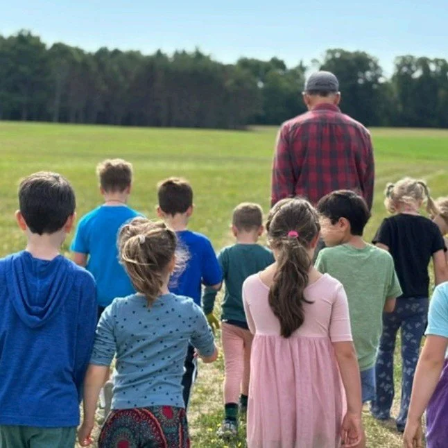 Sally and Aila's first- and second-grade class headed out to the fields at Estes Farm. They learned how to water crops when there is no rain and how to identify different pests looking to eat fruits and vegetables. Students helped pick potatoes, squa