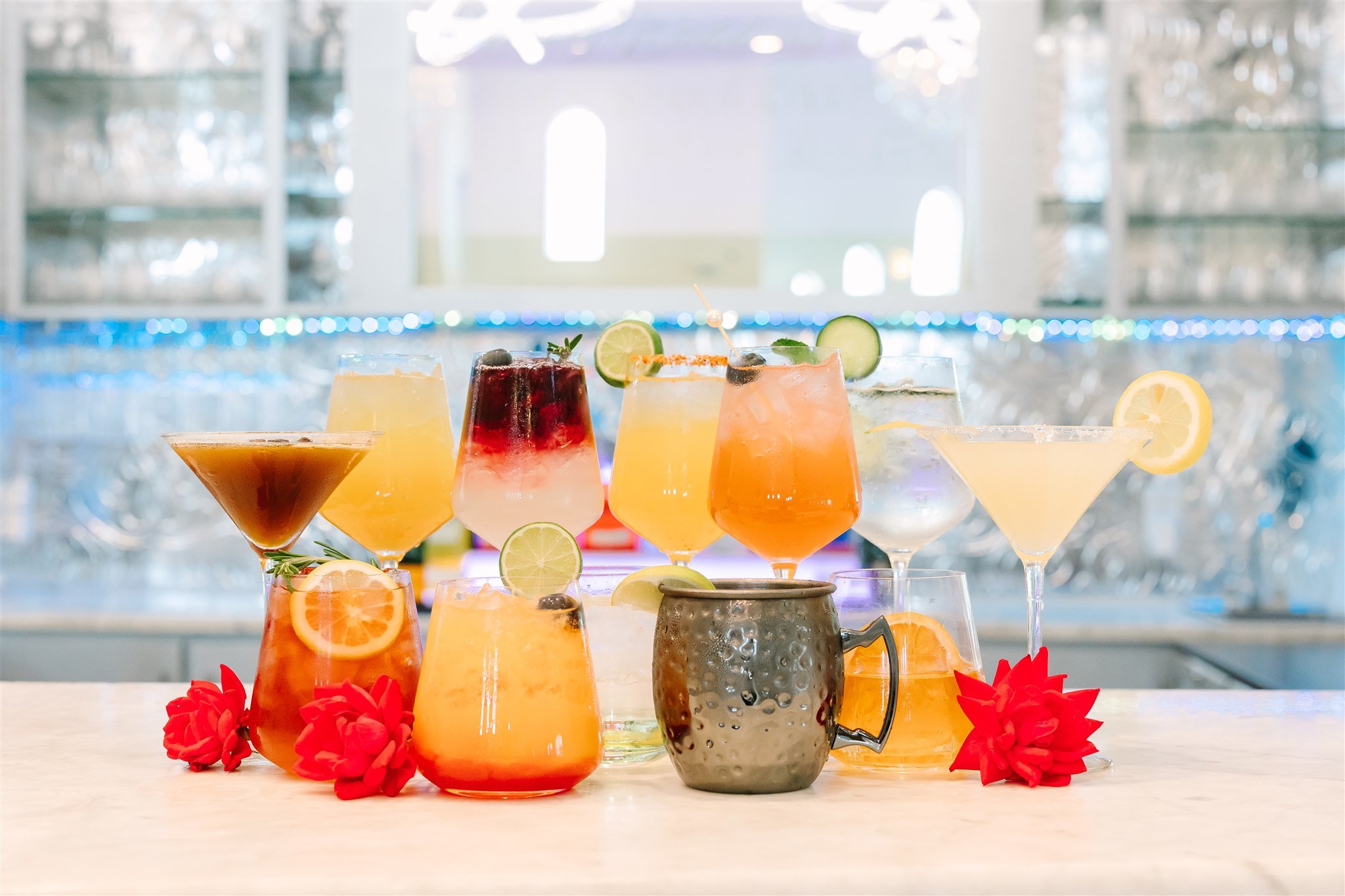 Professional bar service at Knotting Hill Place wedding venue featuring signature  cocktails, colorful beverages, fresh fruit garnishes, and full-service bar options  for wedding receptions and celebrations