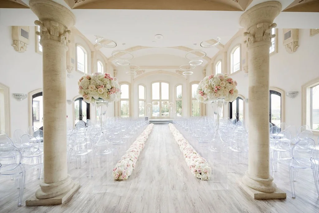 Elegant indoor wedding ceremony at Knotting Hill Place with bride and groom  at altar, 55-foot ceilings, and 300 seated guests in formal attire