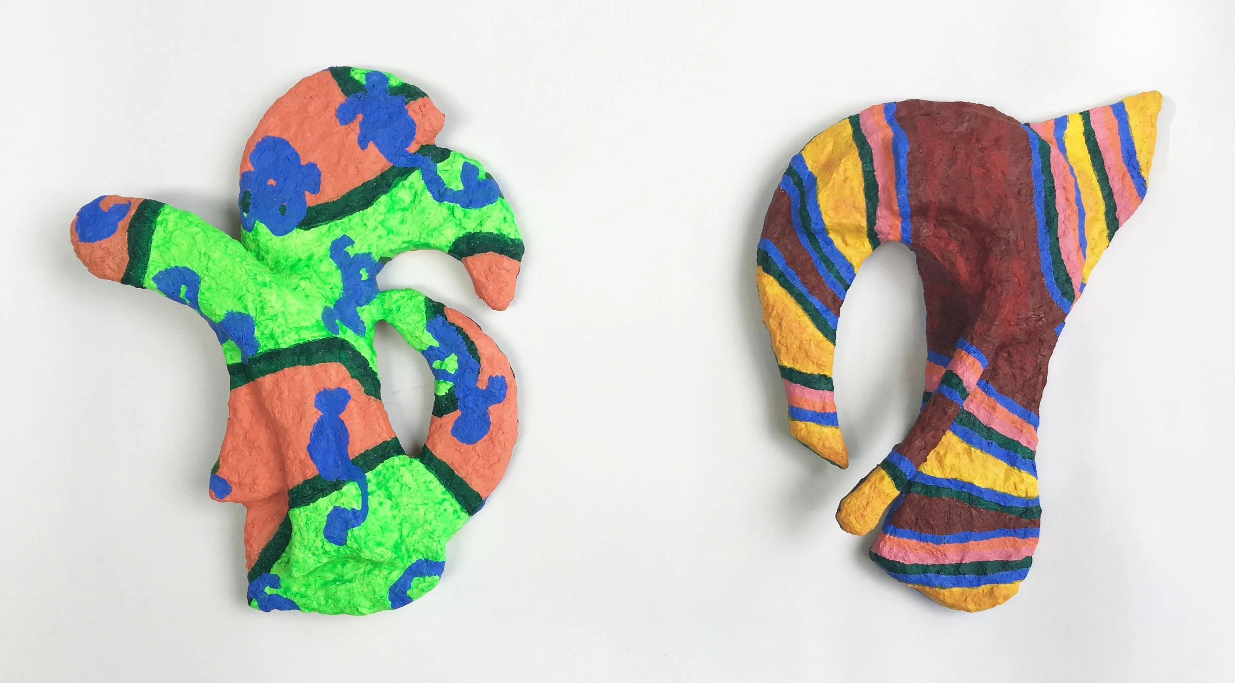 (Left) Abstract Glyph #2 (front) , 2019, plywood, Sculptamold, acrylic paint (Right) Abstract Glyph #1 (front) , 2019, plywood, Sculptamold, acrylic paint