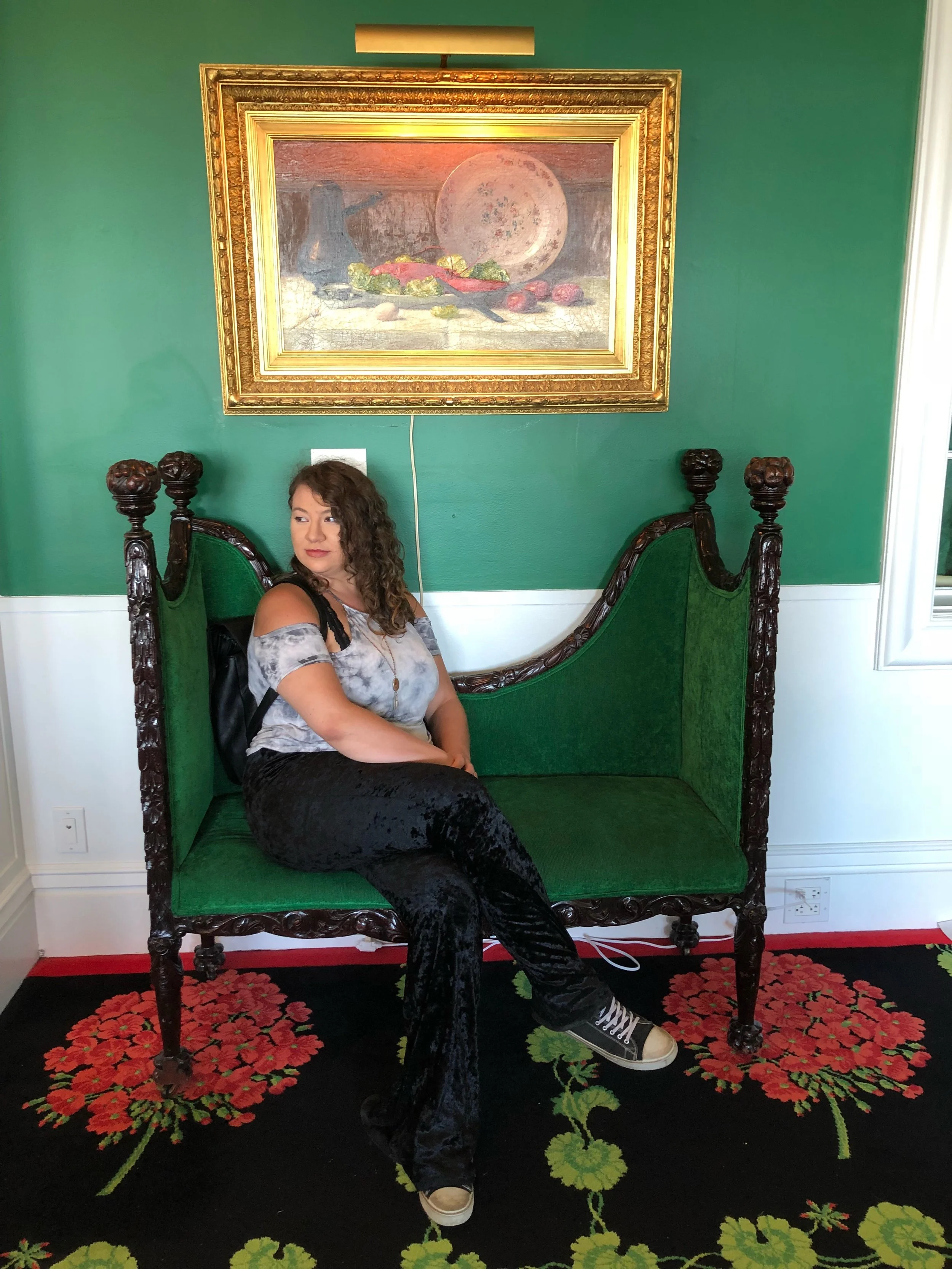 Lady Lydia posing on a bench.