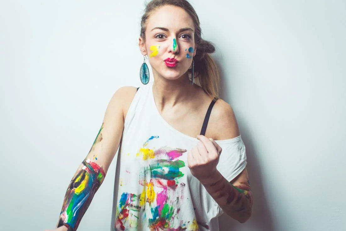 young-woman-having-fun-with-paints.jpg