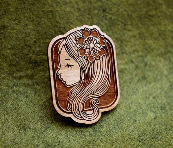 engraved wooden brooches. 2010. limited edition of 1200.