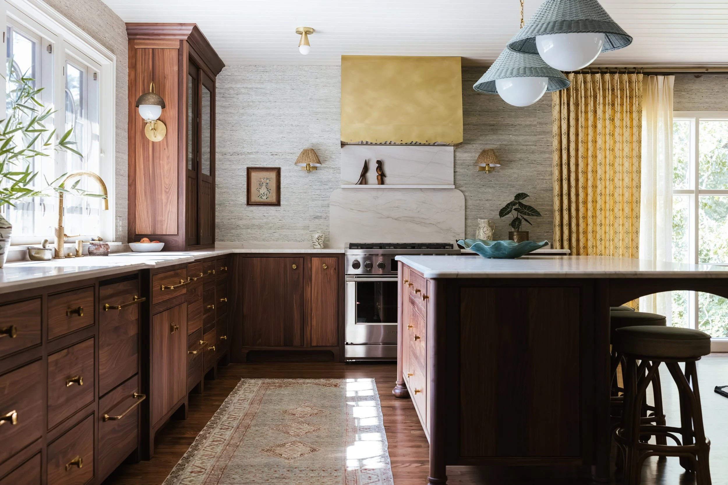 Black Walnut Kitchen Cabinets with Custom Island in custom brass range hoods Athens, Georgia. 