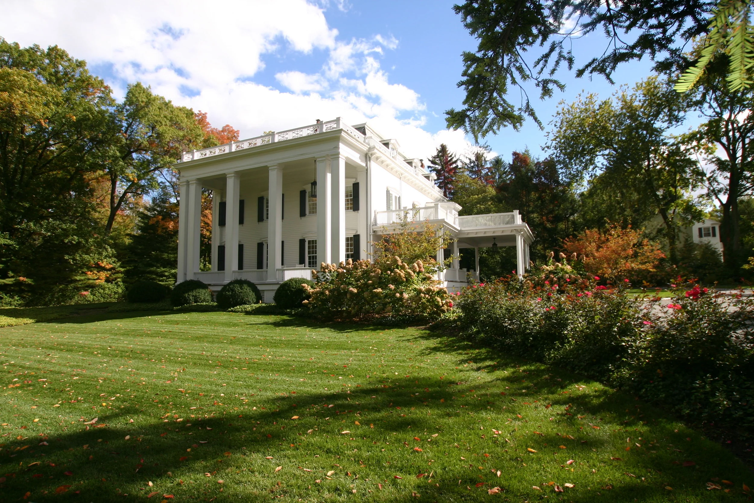 A traditional landscape that highlights the home. It puts the house on a stage. 