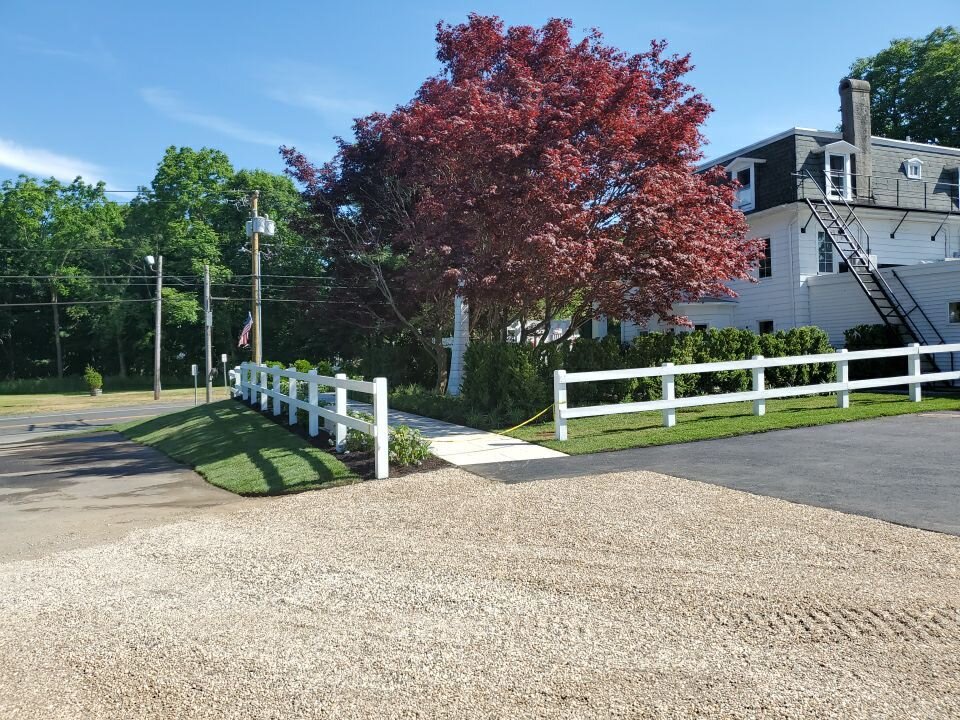 The fence is also the common thread that ties all the outdoor spaces together and provides way-finding throughout the property. The plantings are representative of traditional Long Island landscapes, creating a familiar feeling. Photo: Joe Gentile