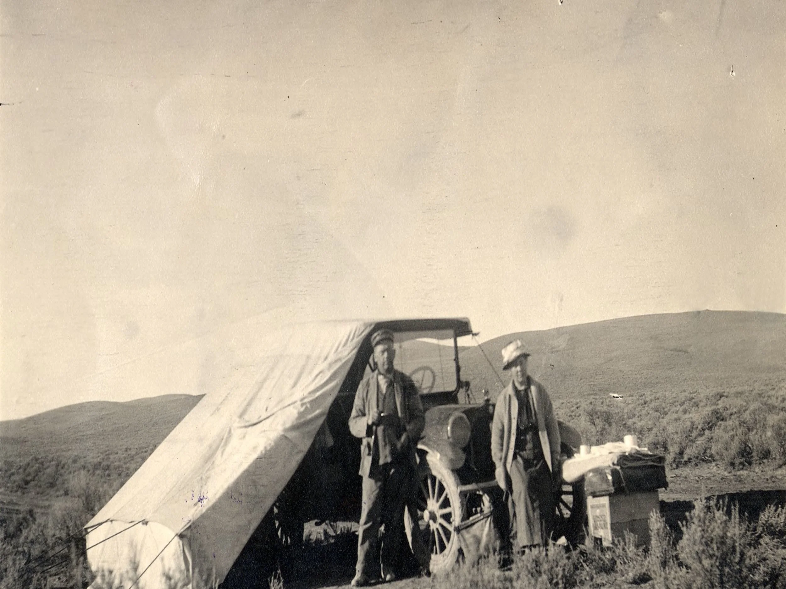 Camping, 1914, showing a pre-WWI automobile outfitted with a tent. Image/ Special Collections Department, University of Nevada, Reno, Libraries.