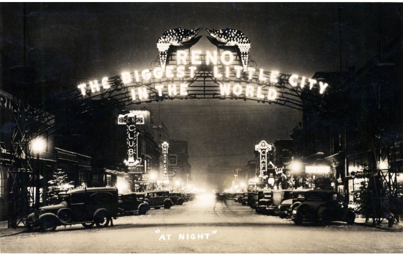 Virginia Street and the Reno Arch at night, Reno, Nevada, circa 1931.