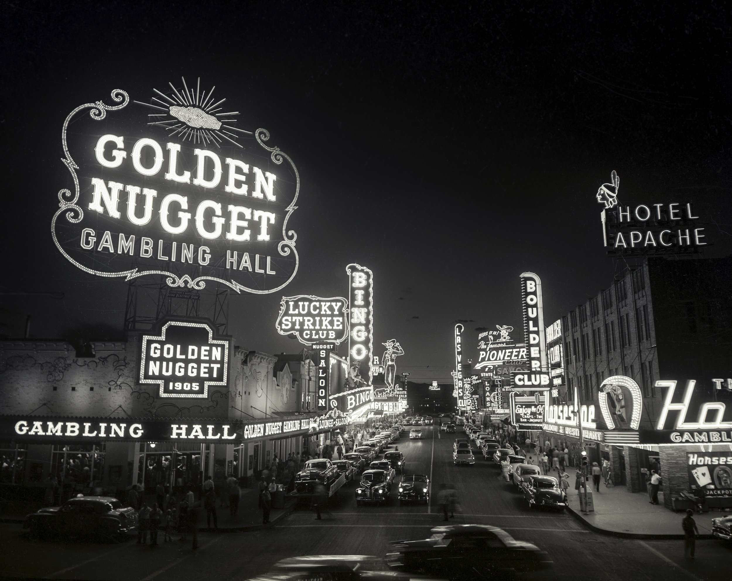  By 1954, the Boulder Club, located on the right, no longer had the most prominent neon sign on Fremont Street. Las Vegas’ attraction to neon was growing. 