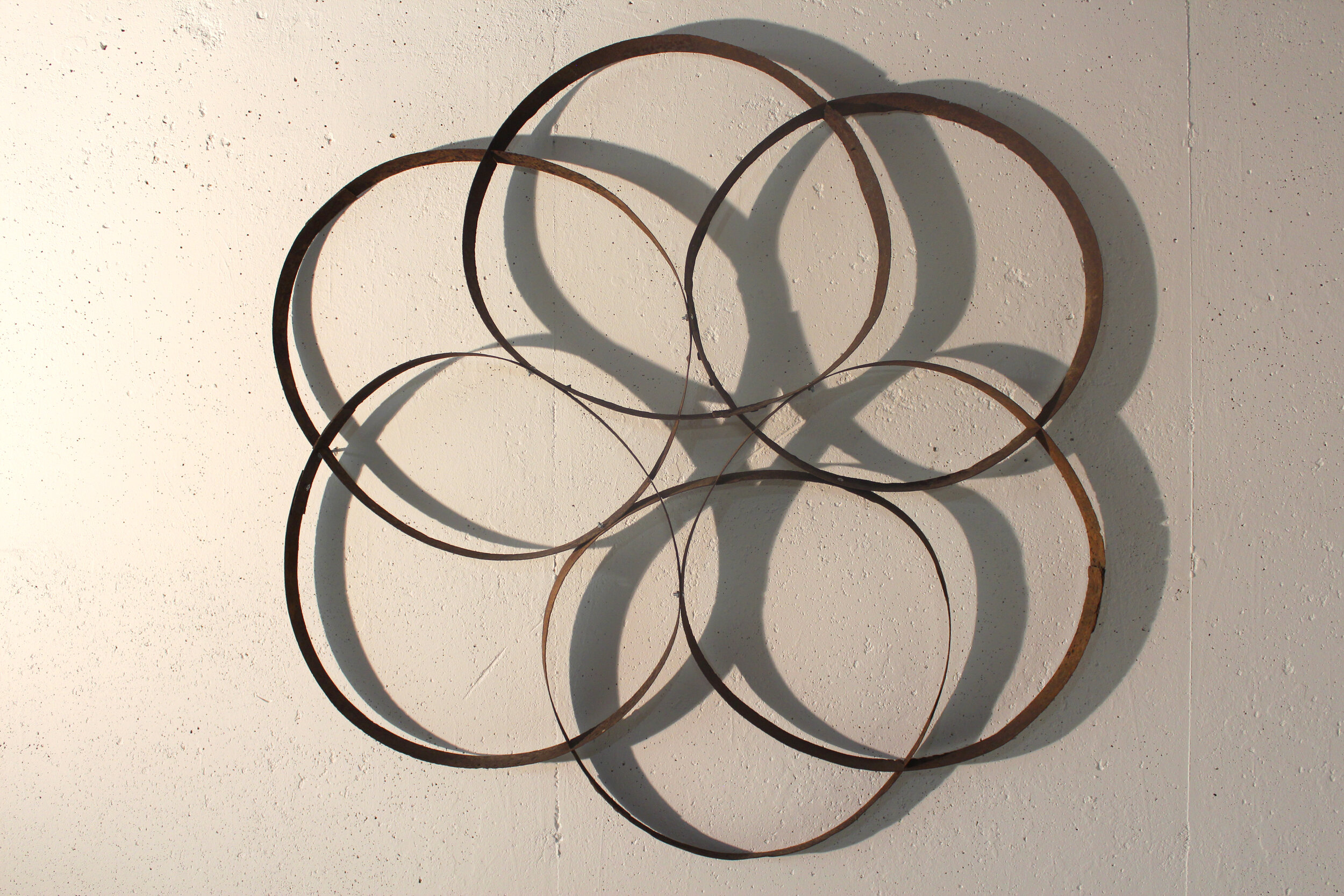  “Back 40 Liquor Store,” (detail), 2020, found metal barrel rings, 46” x 46” 