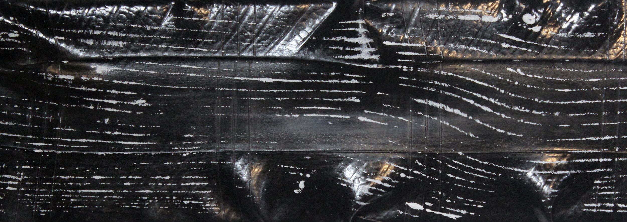  “Passages,” detail, 2022, acrylic and spray lacquer on stretched tractor tire tube, 8”x36” 