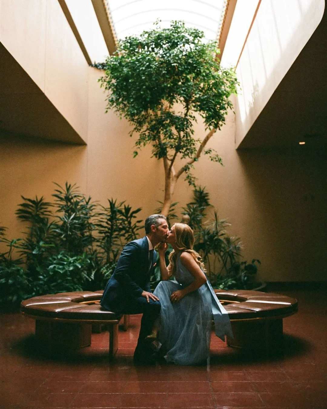 Anniversary portraits with F &amp; A on film 🎞️ 
&bull;
Such a great time with them at this incredible place, and capturing it on a camera from the same era as the building felt like the perfect fit. Their style, the symmetry, and the mid-century ar