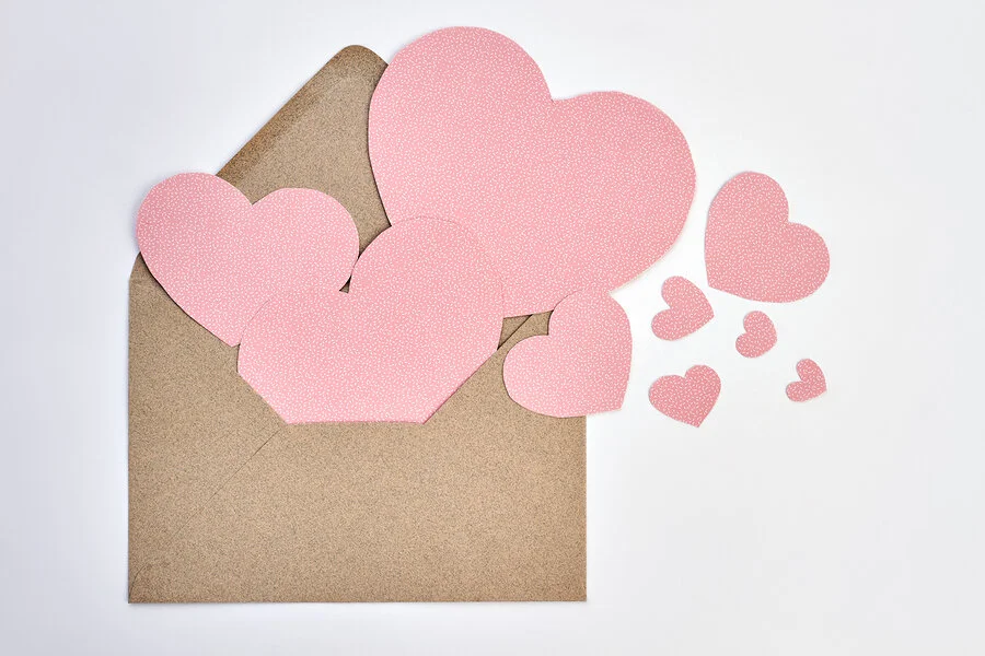 bigstock-Opened-Envelope-And-Pink-Paper-239576392.jpg