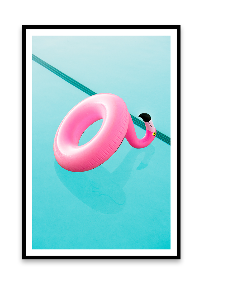 Pink flamingo-shaped pool float resting on the edge of a swimming pool with light blue water.