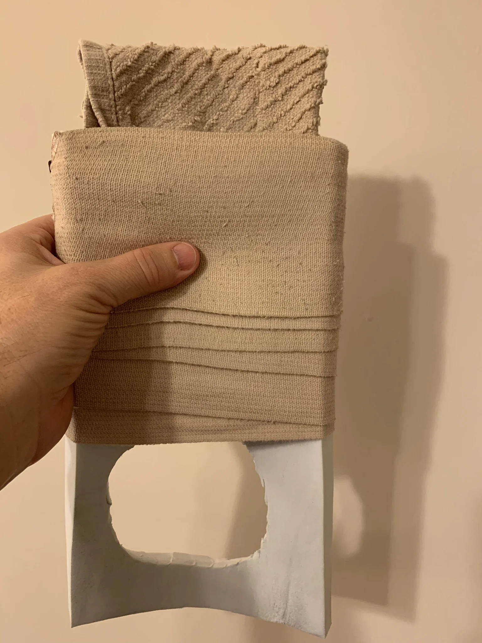 An ace bandage holds a washcloth in place on top of the thick padding I use to accommodate my boot’s inflation buttons so it works with the iWalk. The ultra dense foam sticks to the skin when I’m in shorts. So this adds a breathable barrier.