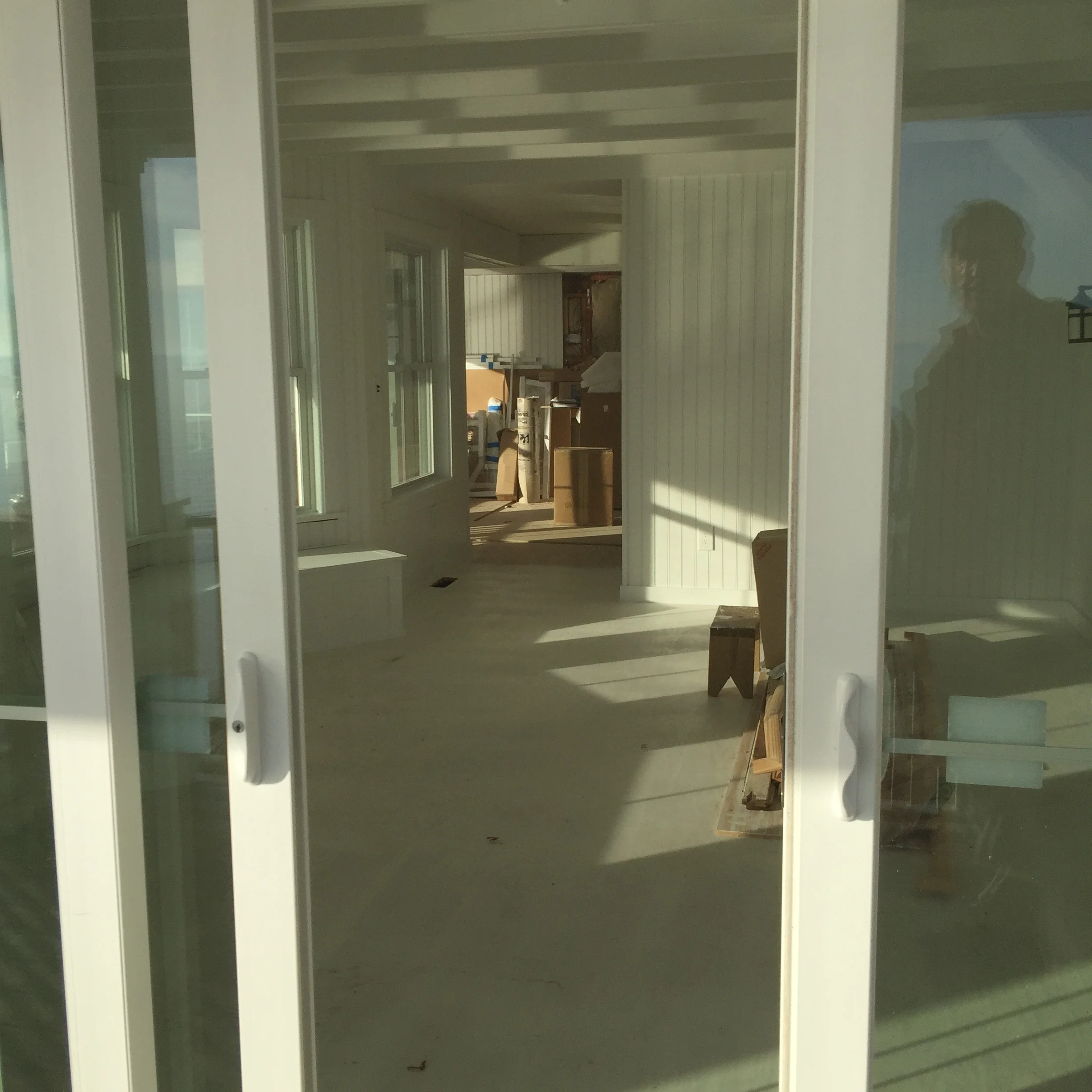 Living room looking into unfinished kitchen 