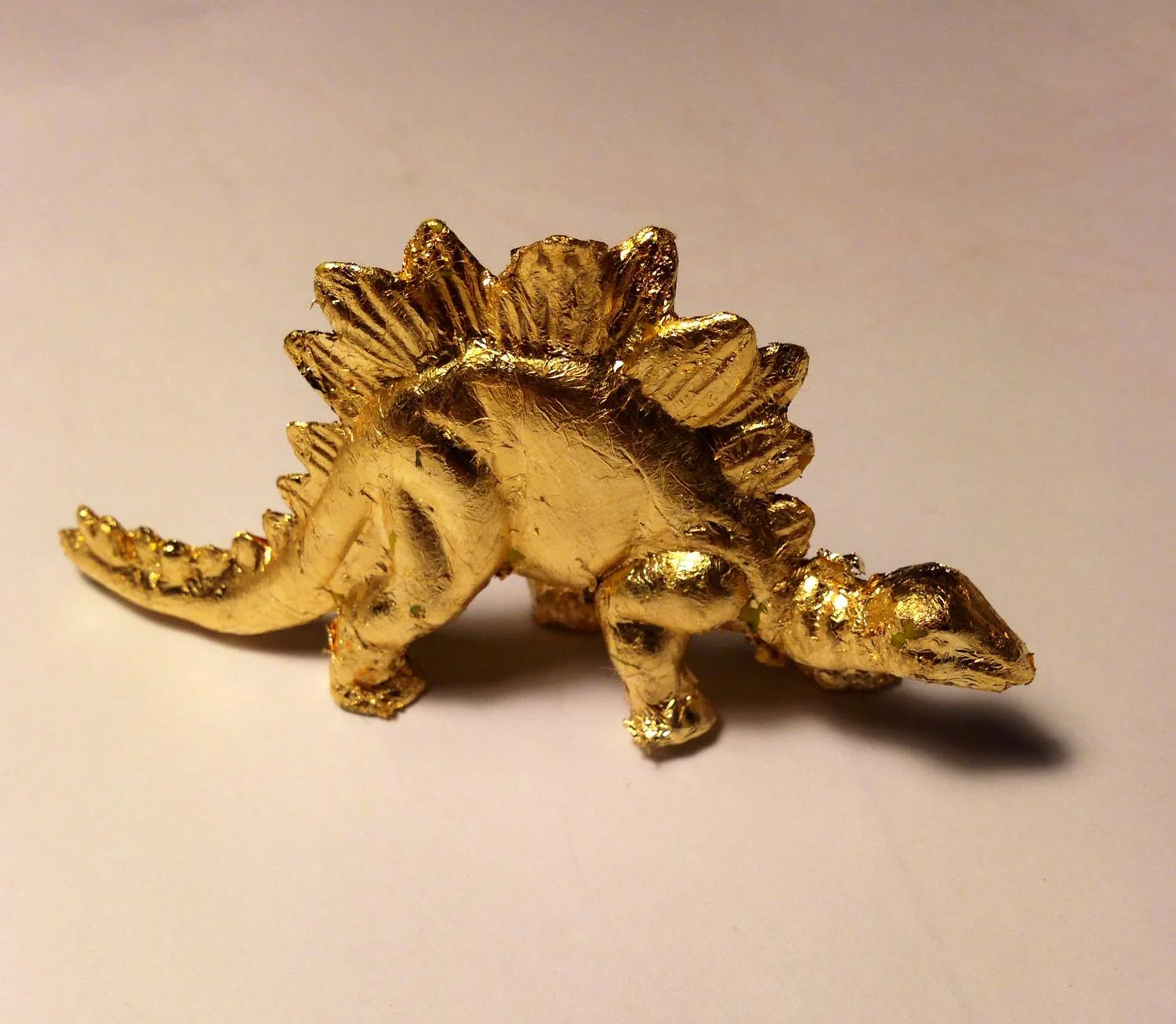 GoldenDinosaur19cmx14cmPlasticandgoldleaf2014.jpg