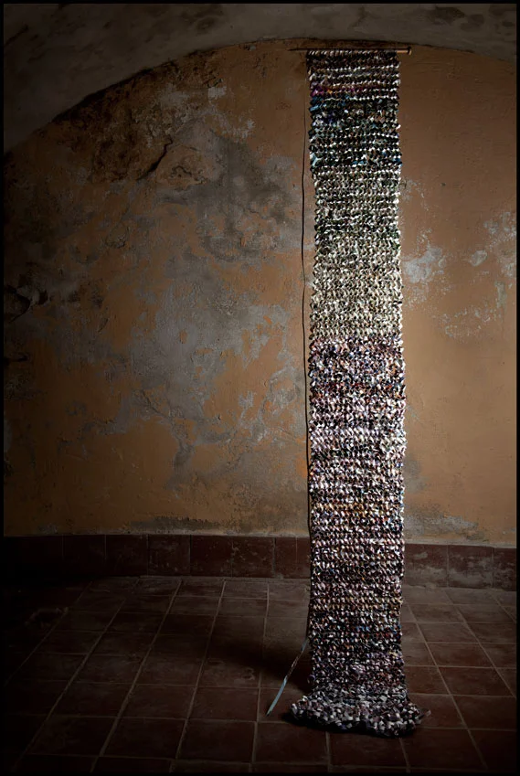 'Knitted Shreds', (shredded photographs, staples, knitting needles), 2012.