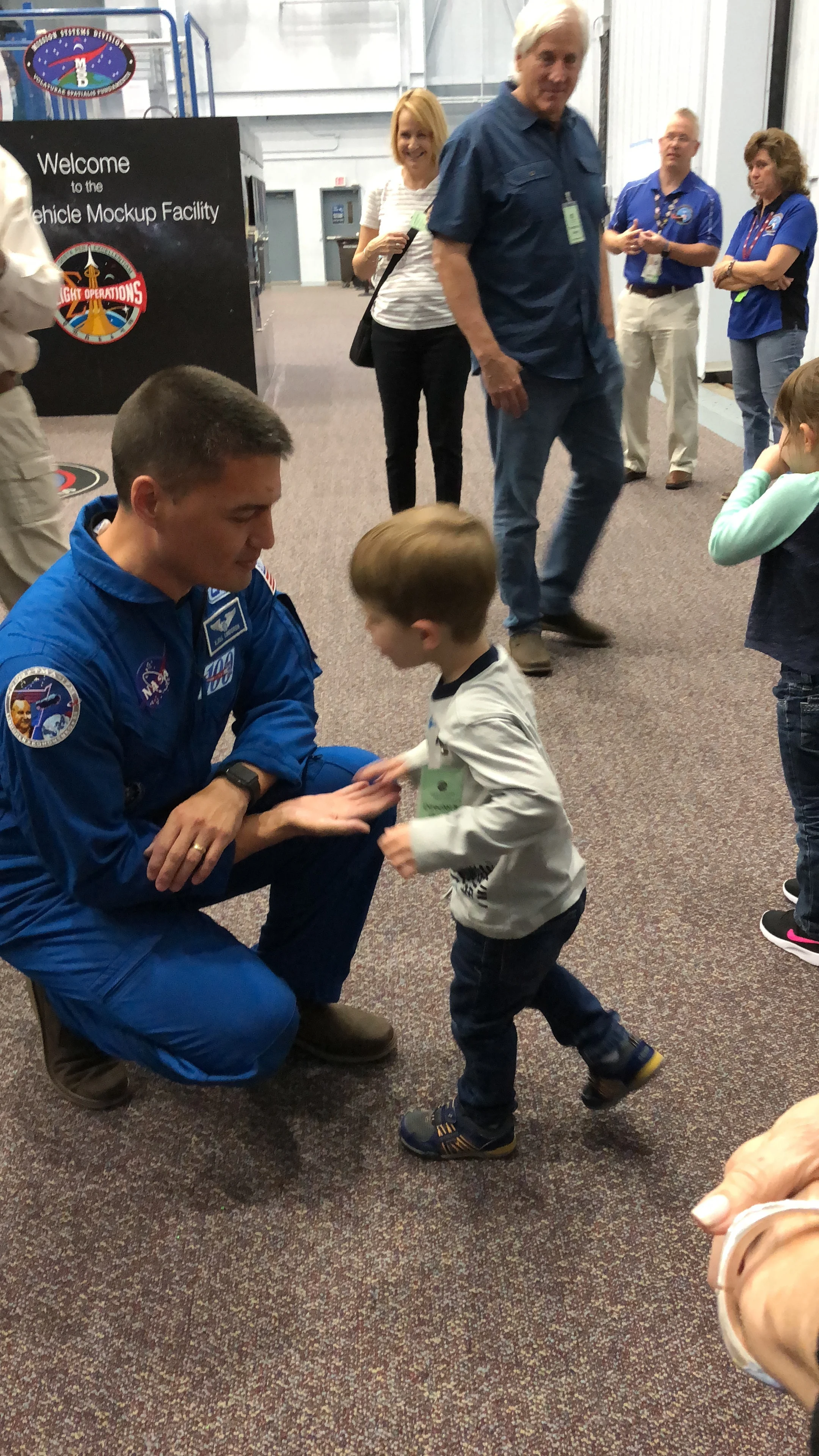Dr. Kjell N. Lindgren was selected to be an astronaut by NASA in 2009. Here, he is seen with our young cousin Josh Hacker at the Space Vehicle Mockup Facility at NASA in Houston, Texas - October 2018