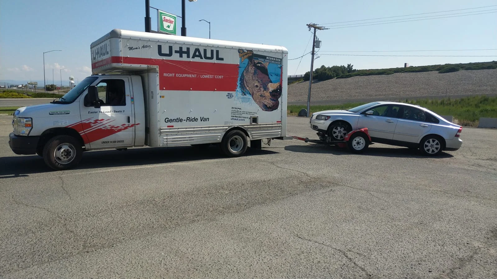 U-Haul with Judd’s 2006 Volvo hitched on back