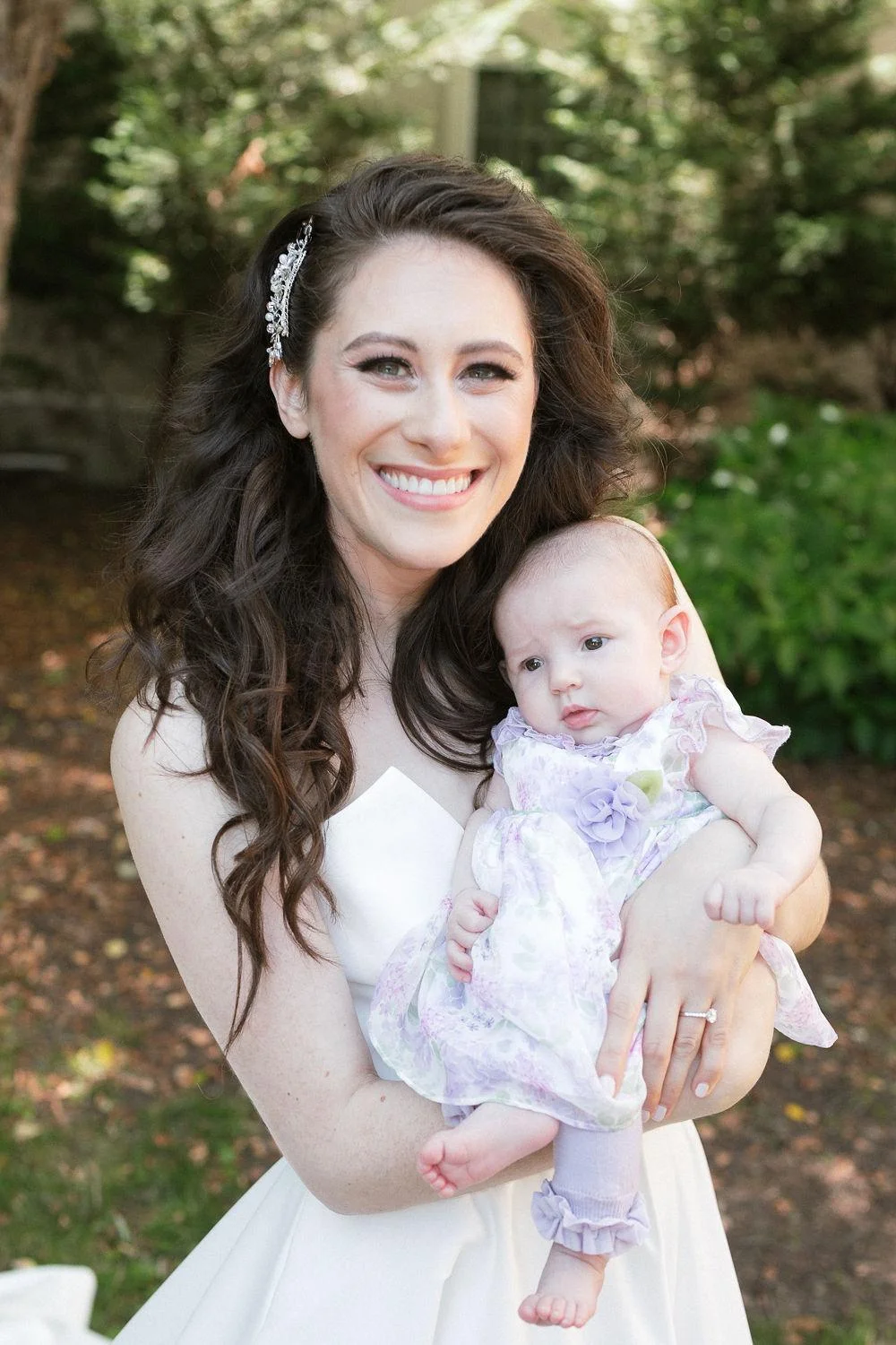 Auntie Rina on her wedding day with our granddaughter, baby Solly-flower girl (credit: Robert Wagner Photographer)