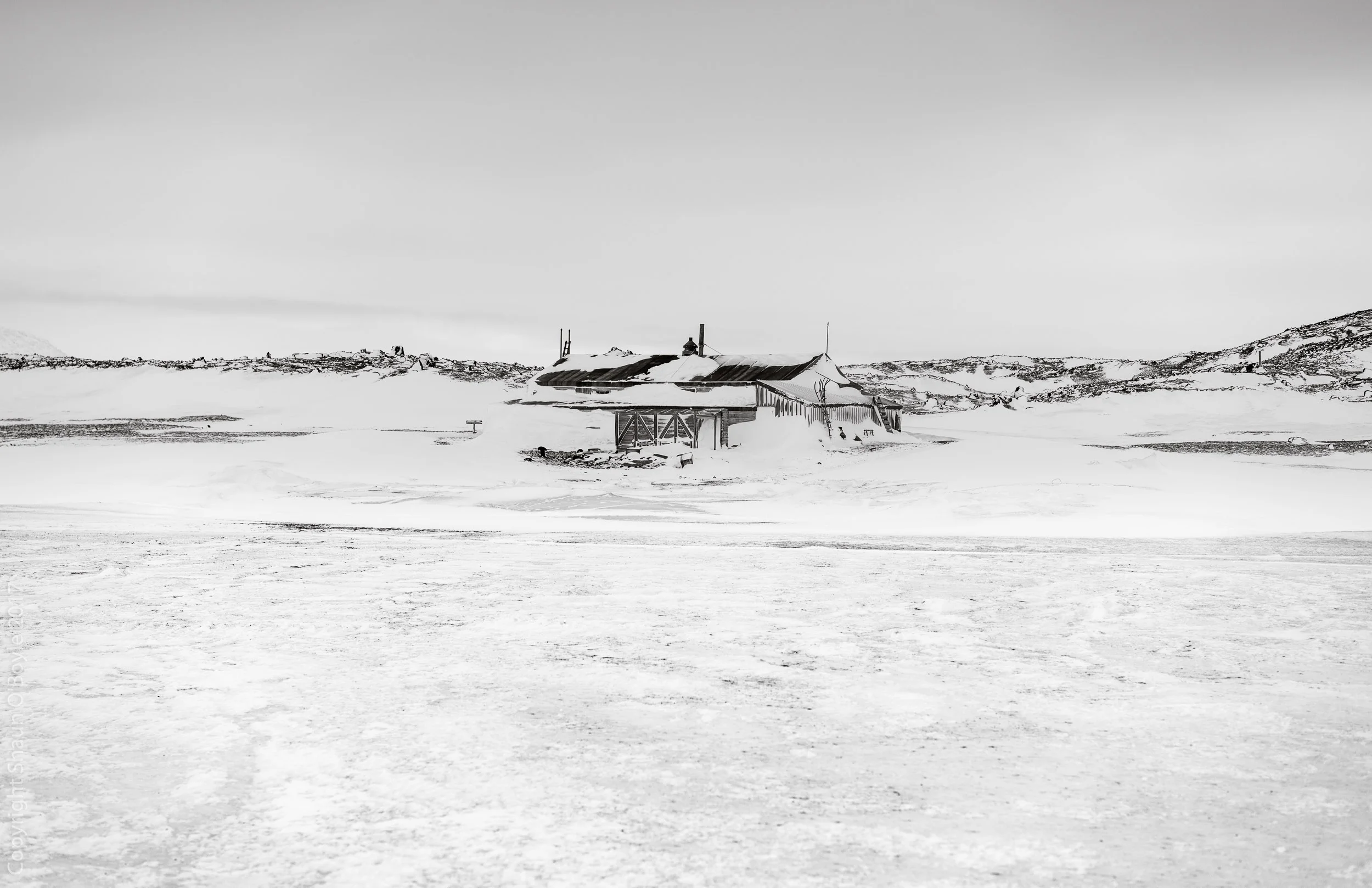 Cape Evans, Antarctica from the sea ice on arrival. The Cape Evans Hut was built by Captain Scott's 1911 Terra Nova Expedition. This is the expedition in which Scott made his fatal attempt to reach the South Pole. This is also the expedition during which Cherry-Garrard, Wilson and Bowers made the Worst Journey in the World winter journey to Cape Crozier to collect Emperor Penguin eggs. 