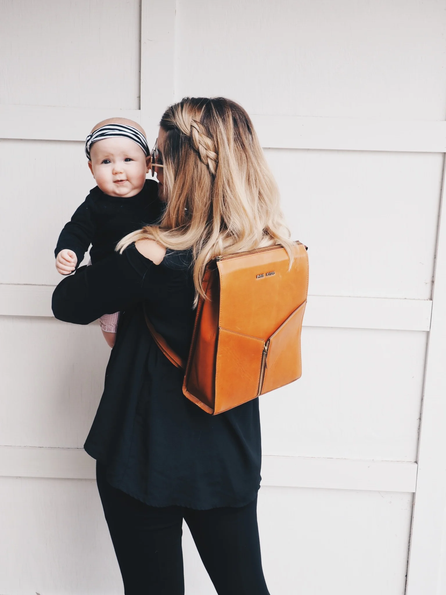leatherbackpackandbaby.jpeg
