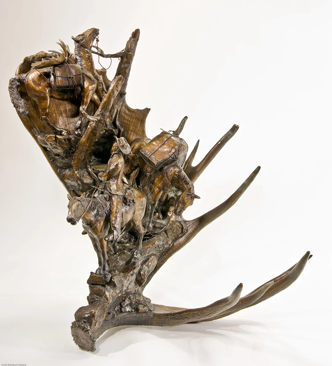   Sixty Inch Trail   Year: 2004  Editon: 25  Size:&nbsp;31 x 25 x 23 (h x w x d, inches)   "We cut the trail for sixty inches but the moose was   sixty six  ." A poem written by one of our guides,   Sixty Inch   Trail tells a story of a moose hunt wi