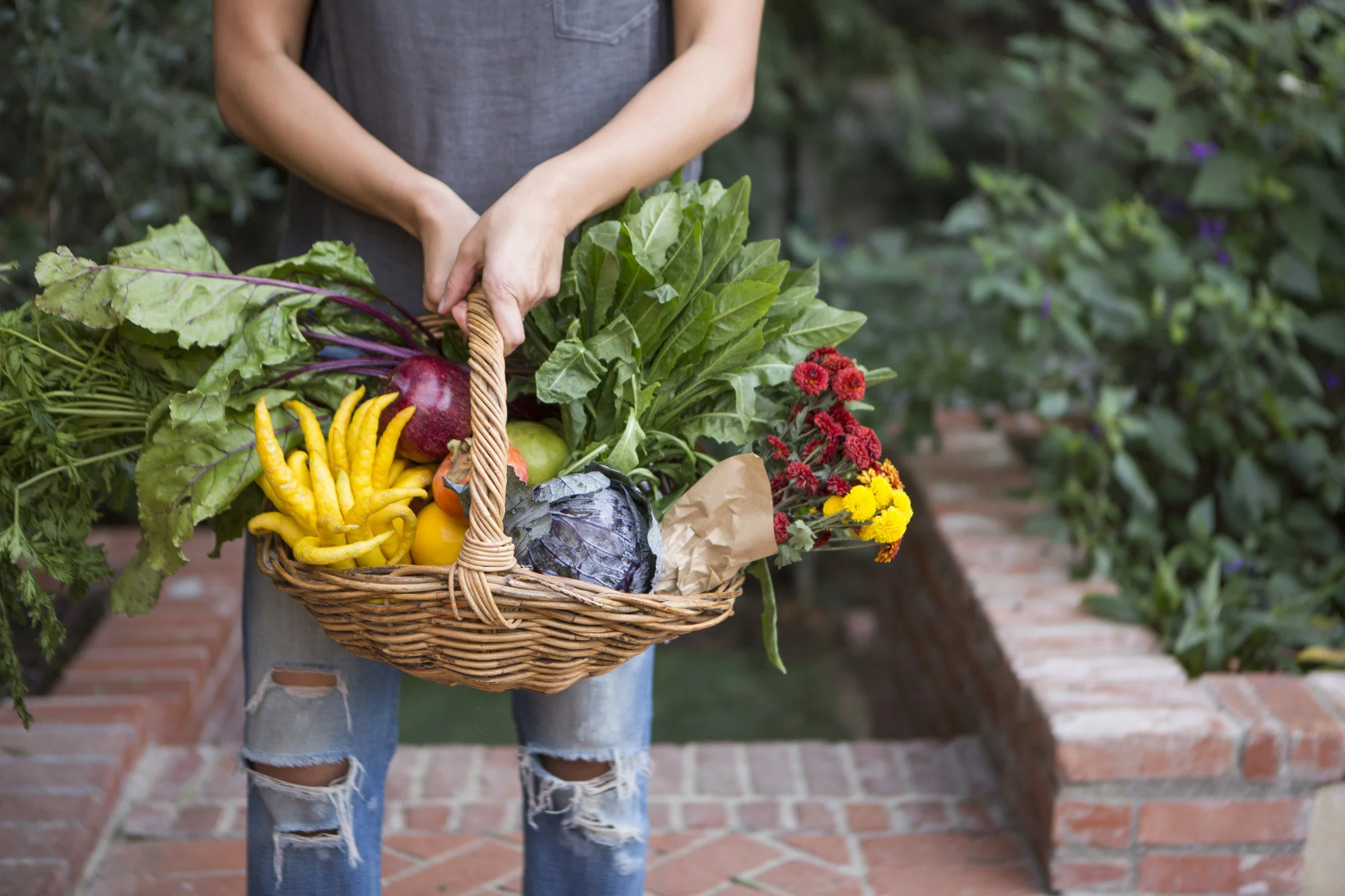 Danielle Ho Moriarty with farmer’s market basket of produce