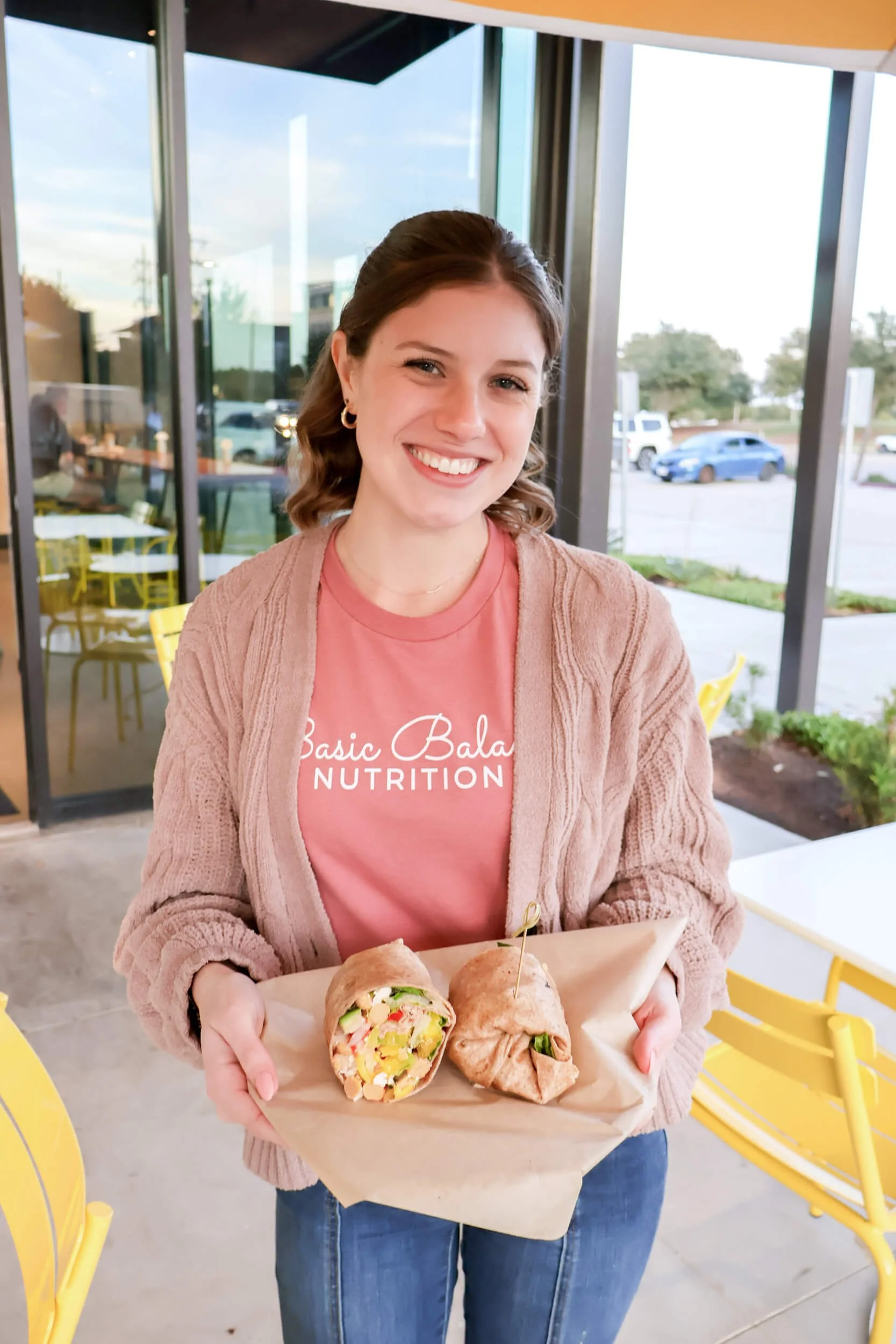 Basic-Balance-Nutrition-Texas-Registered-Dietitians-girl-holding-burrito-outside.jpg