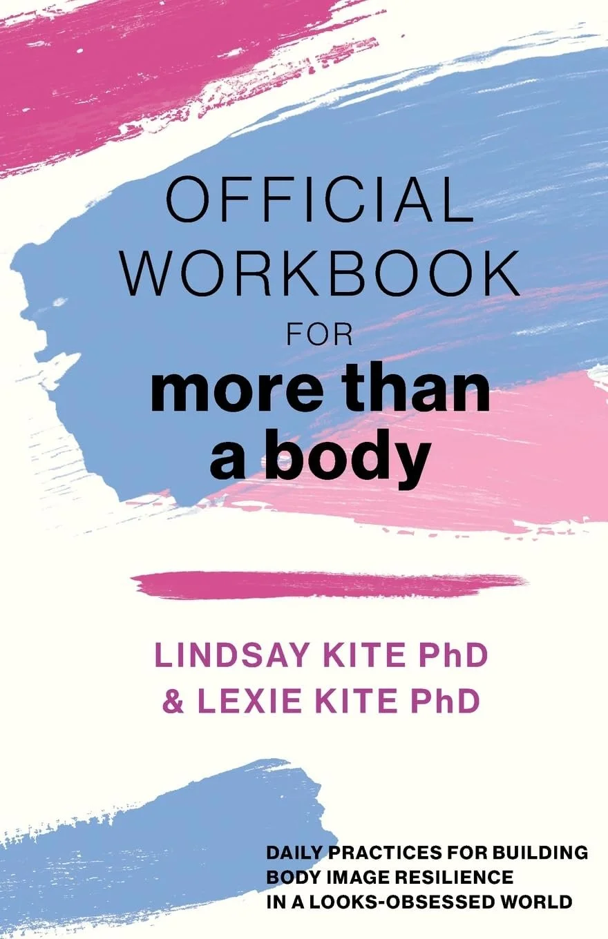 Cover of a book titled 'Official Workbook for More Than a Body' by Lindsay Kite PhD and Lexie Kite PhD, featuring pink, blue, and white brushstrokes.