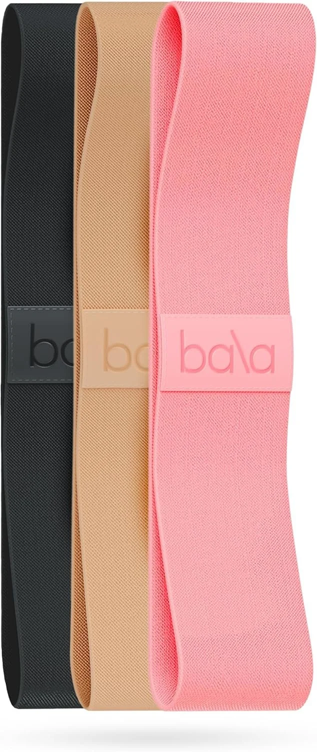 Three resistance exercise bands in black, beige, and pink colors, each with the brand name 'bala' on a label.