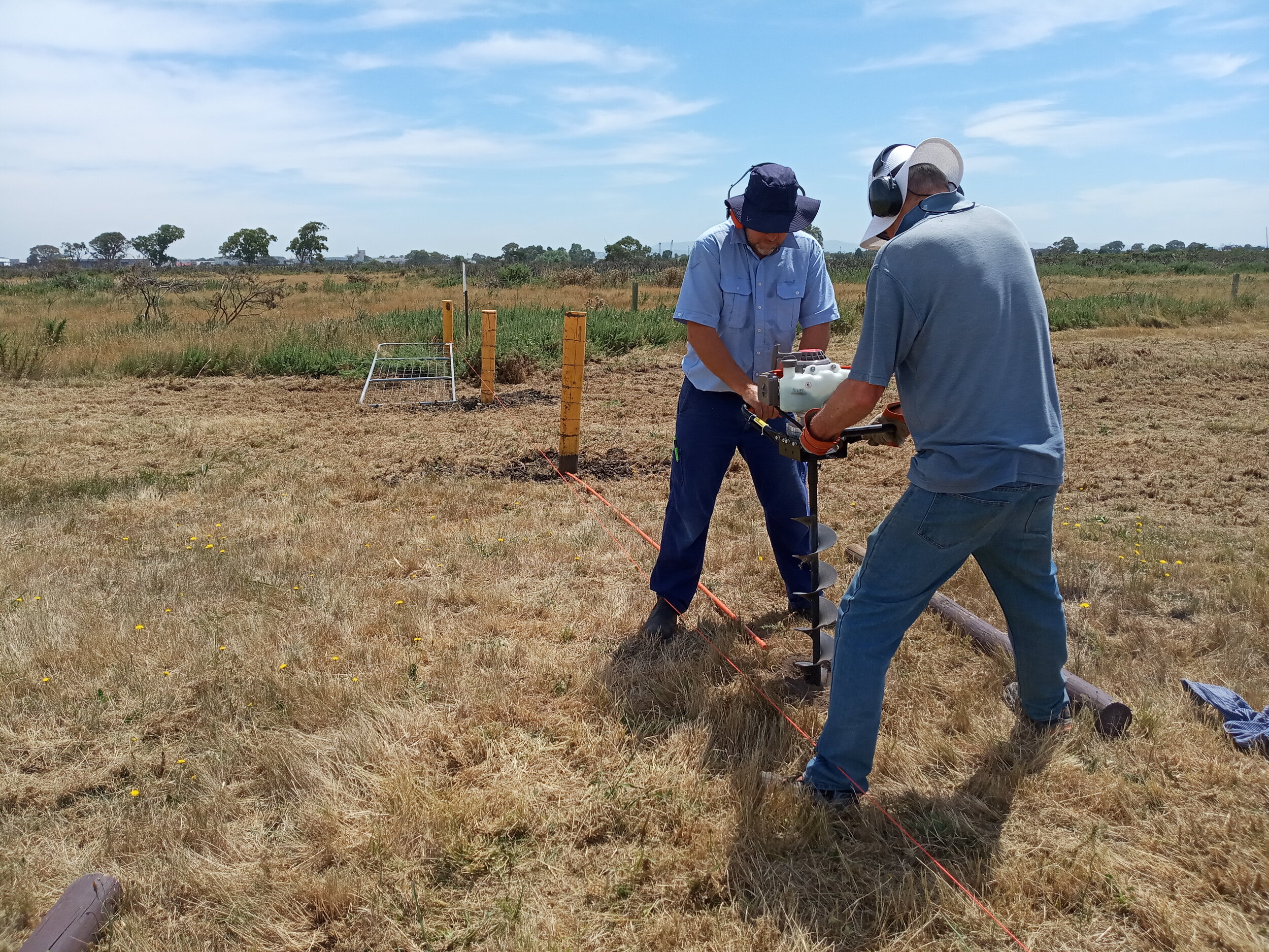  13/1  North end of the NS Fence. Bill S &amp; Ben F on the auger drilling posts for the 4.2m + 2.4m gate  Click to see more 