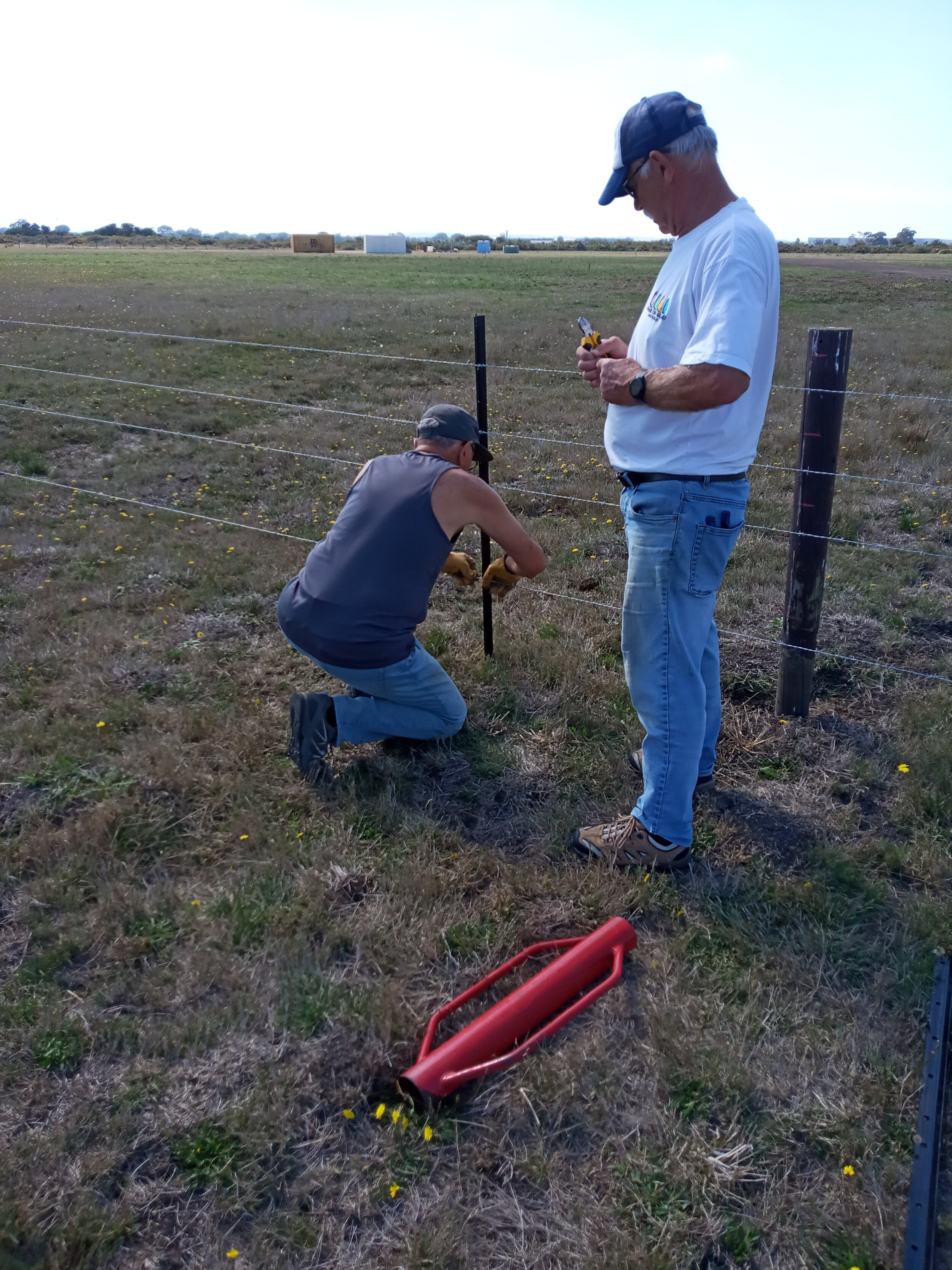  31/3  The final stake in the N-S fence.   Dino T and Rob B on the job. 