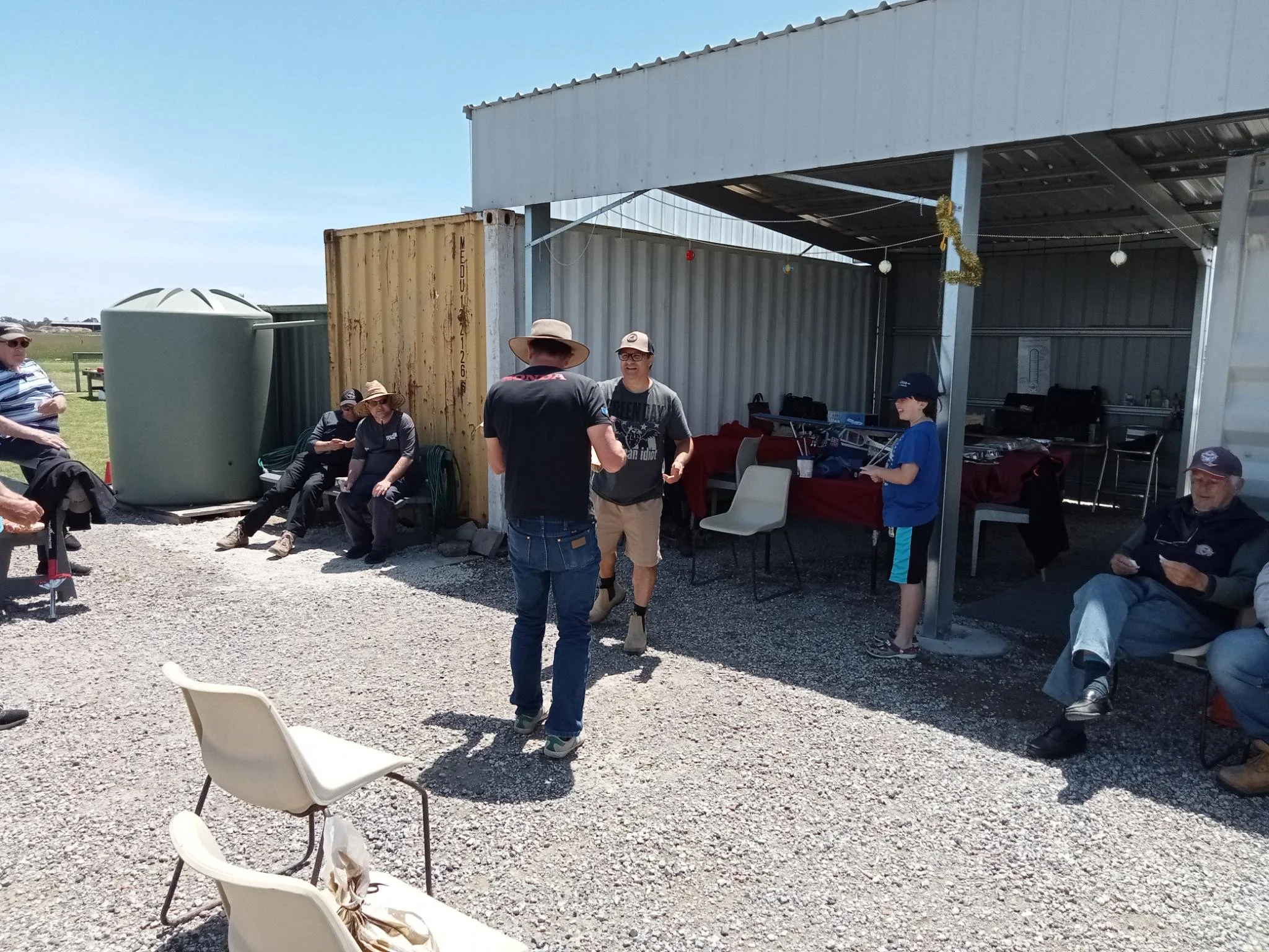  7/12/2025 - Christmas function. Nick C collecting minor raffle prize from Petro. 
