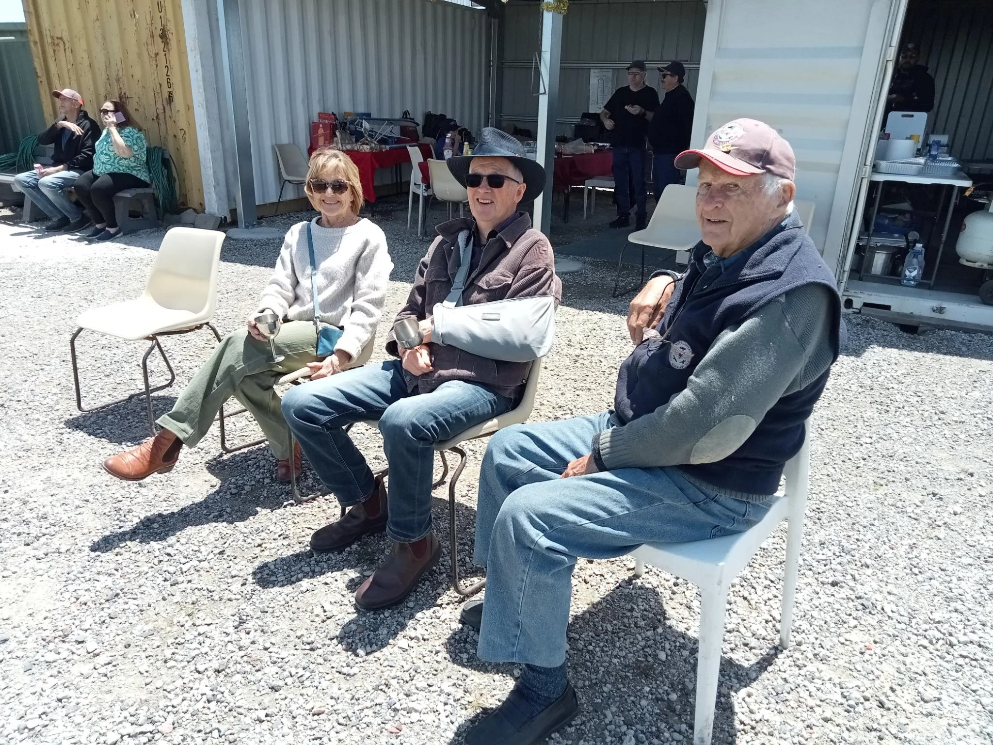  7/12/2025 - Christmas function. Col, Len, &amp; Julie enjoying the sun. 