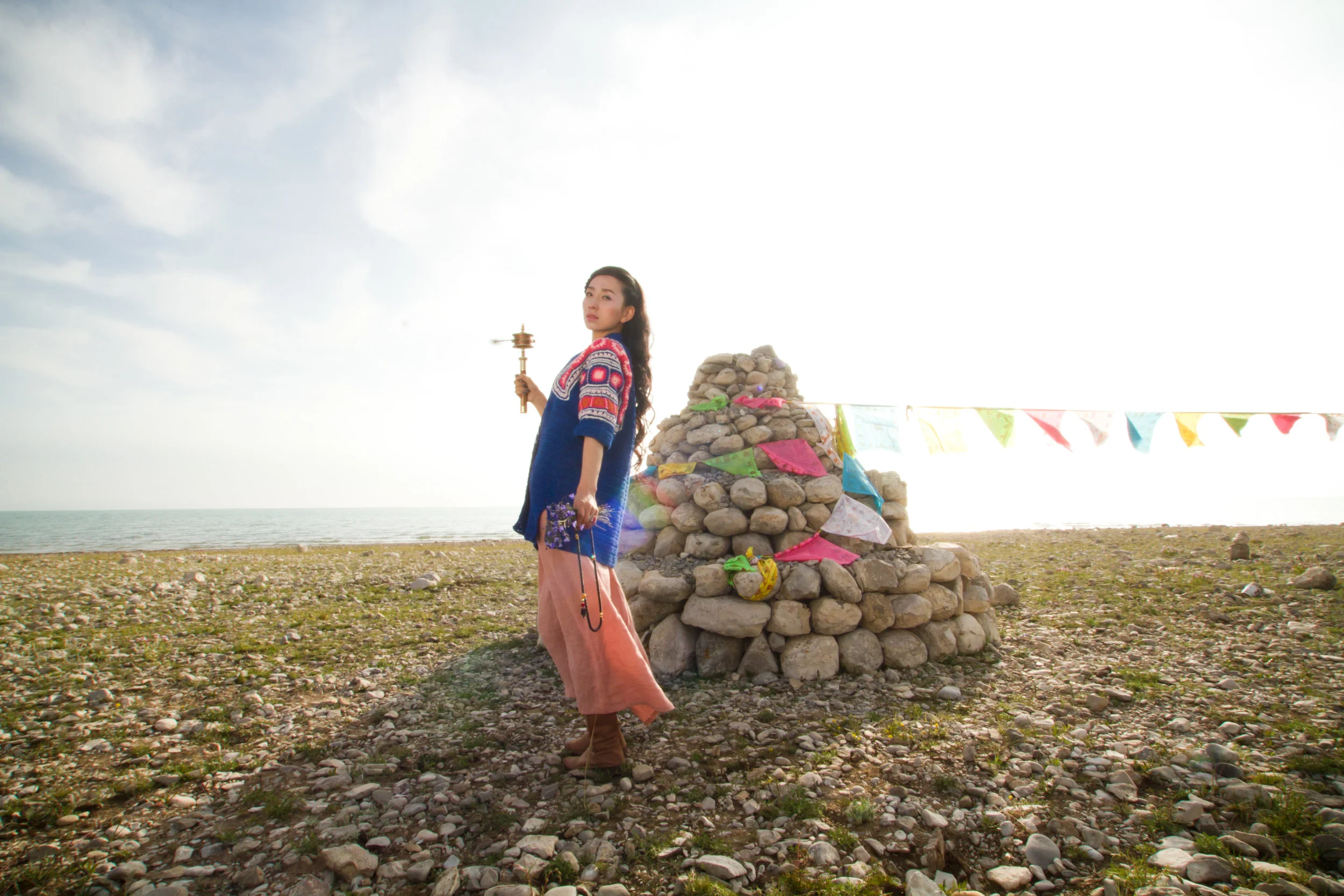 Prayer and meditation comes in many forms in traditional Tibetan culture. Featured here is a stone stupa with prayer flags that can be circled while spinning a prayer wheel and chanting.