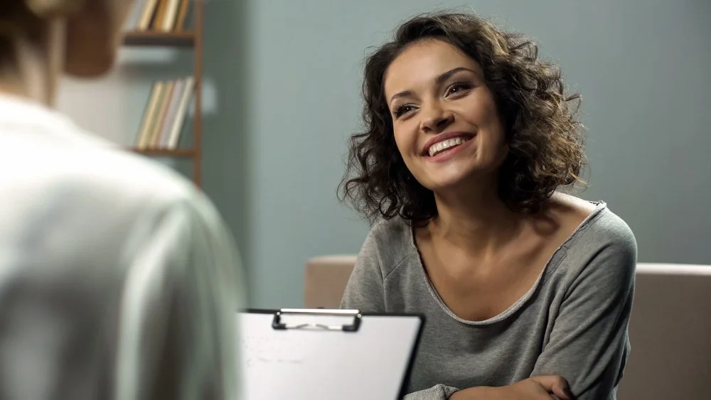 Woman smiling during therapy session