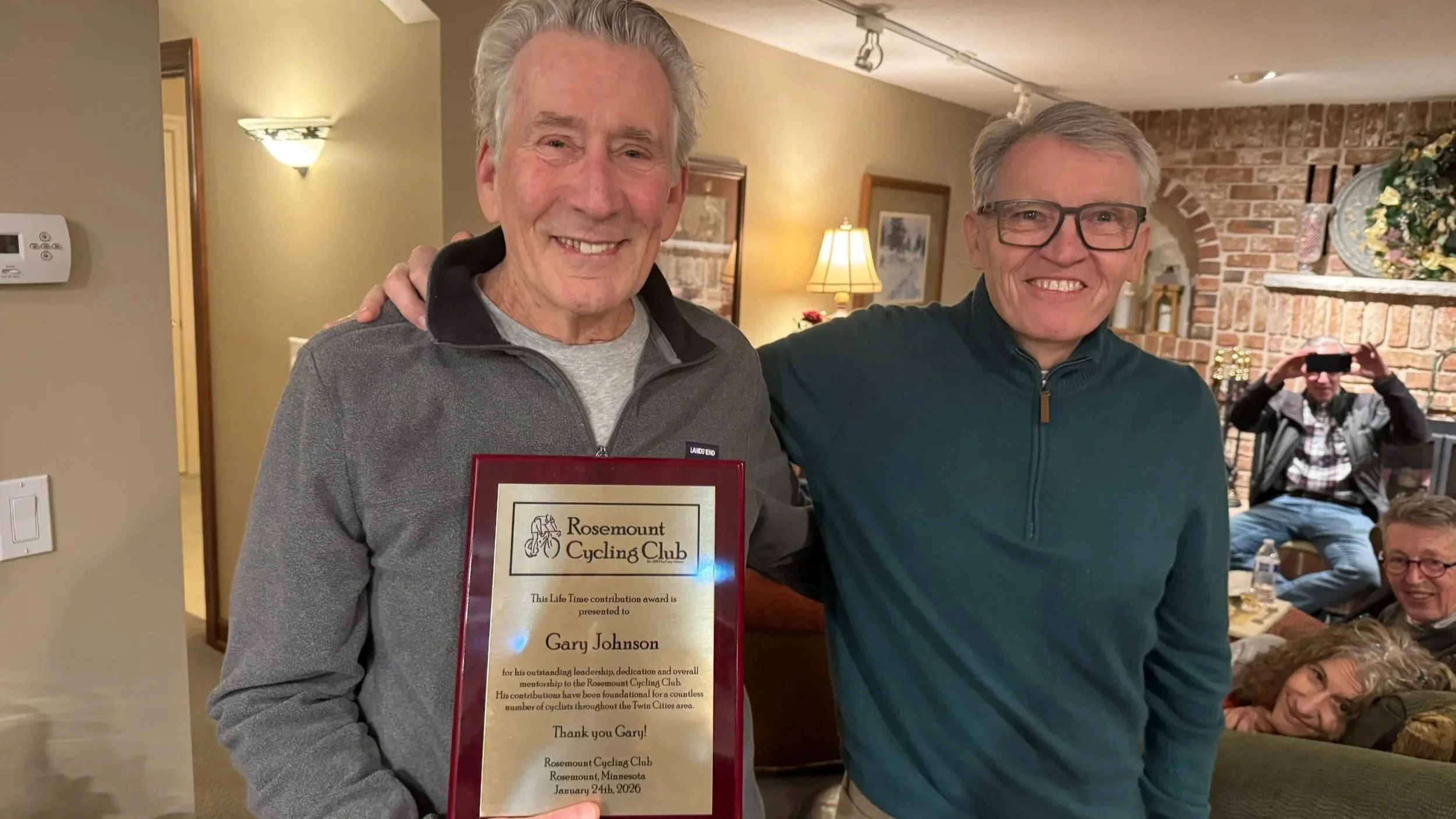 Mark Parr presents a Lifetime Contribution Award to Gary Johnson at our Winter Gathering; 2026-01-24