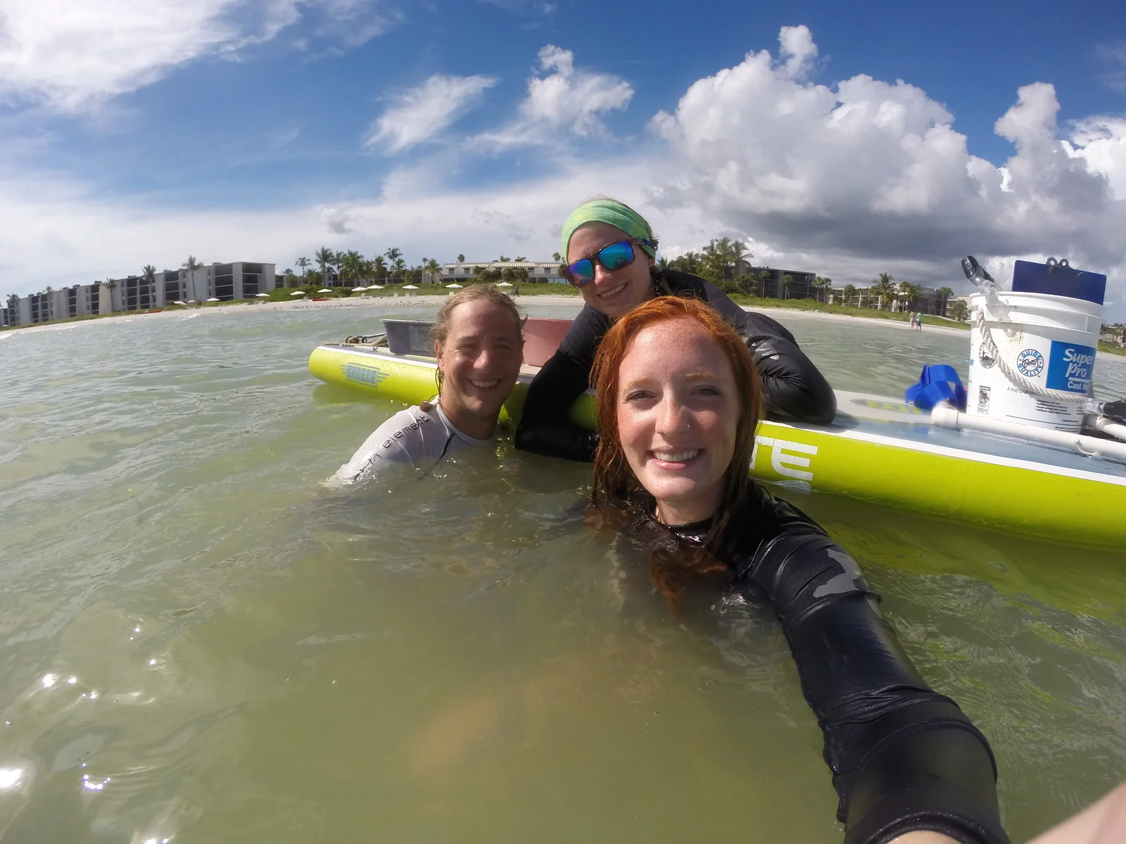 Sanibel Sea School’s sand dollar research team uses a stand up paddleboard to transport their gear.