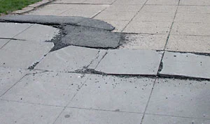 sidewalk-broken-pavement.jpg