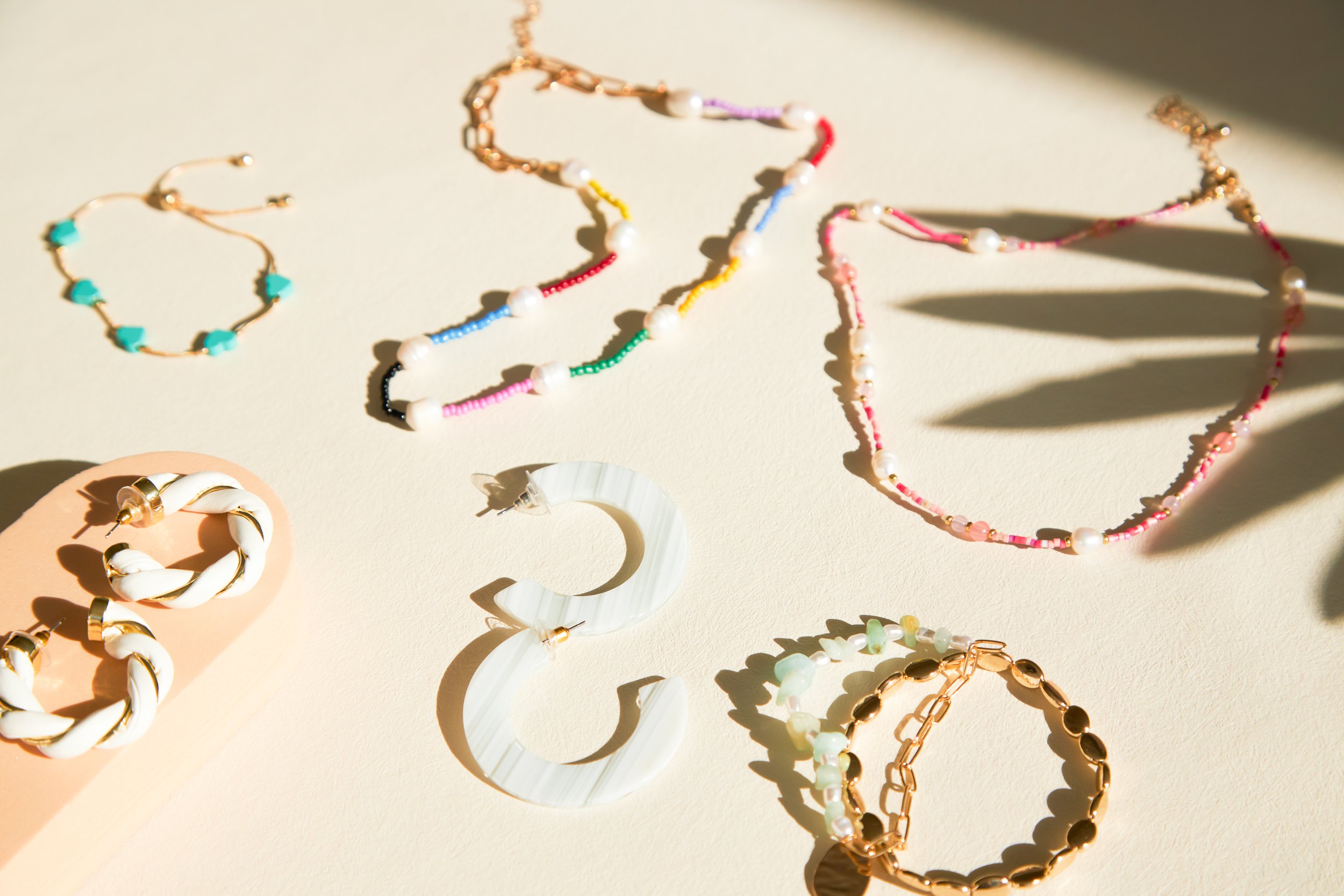 BIRDY GREY_HONEYMOON JEWELRY_HERO FLAT LAY_RT_15.jpg