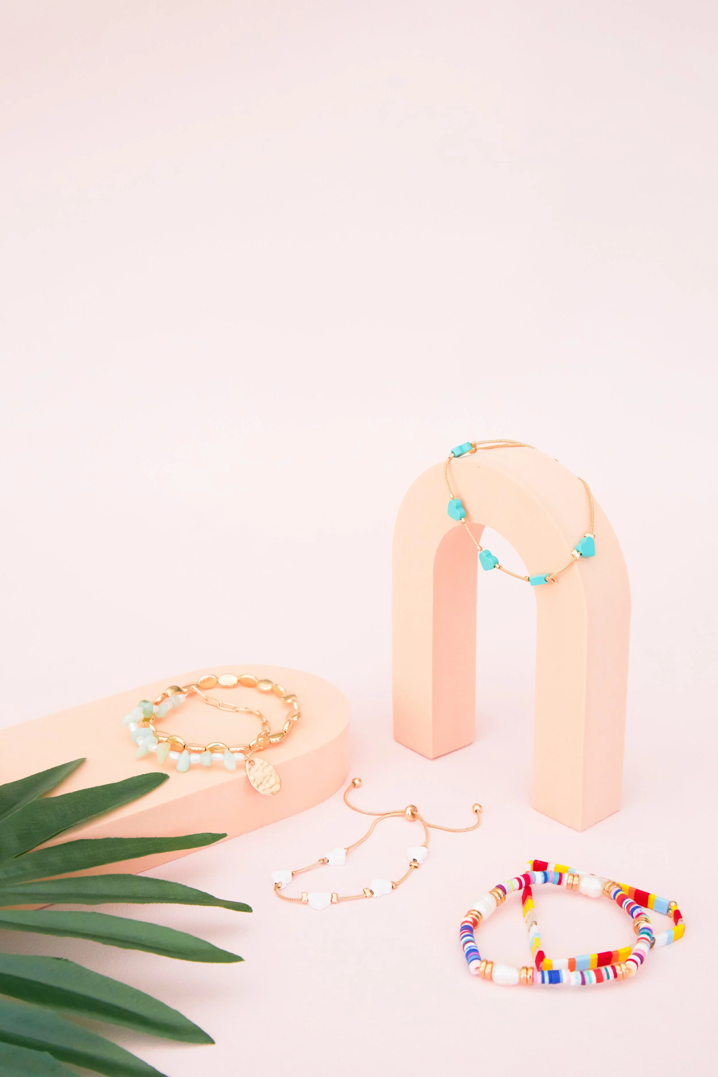 BIRDY GREY_HONEYMOON JEWELRY_HERO FLAT LAY_RT_10.jpg