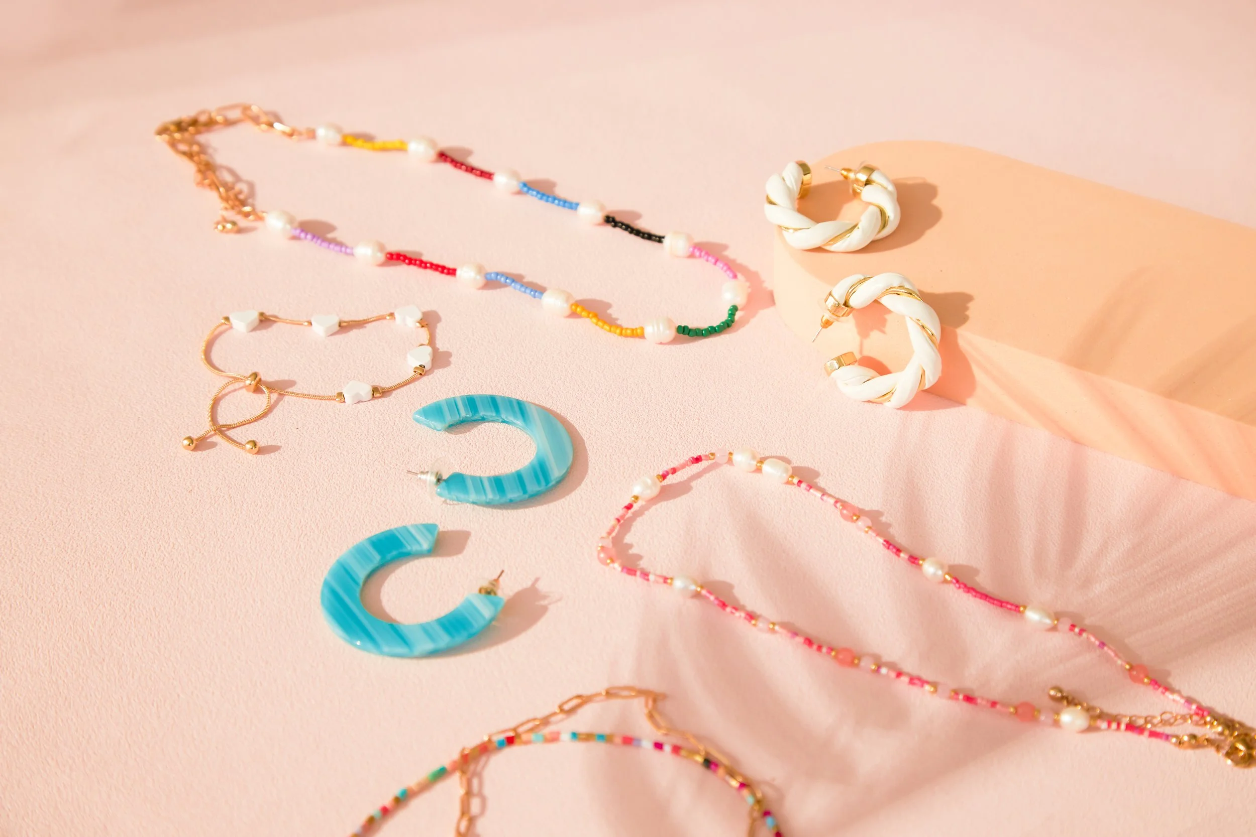 BIRDY GREY_HONEYMOON JEWELRY_HERO FLAT LAY_RT_01.jpg