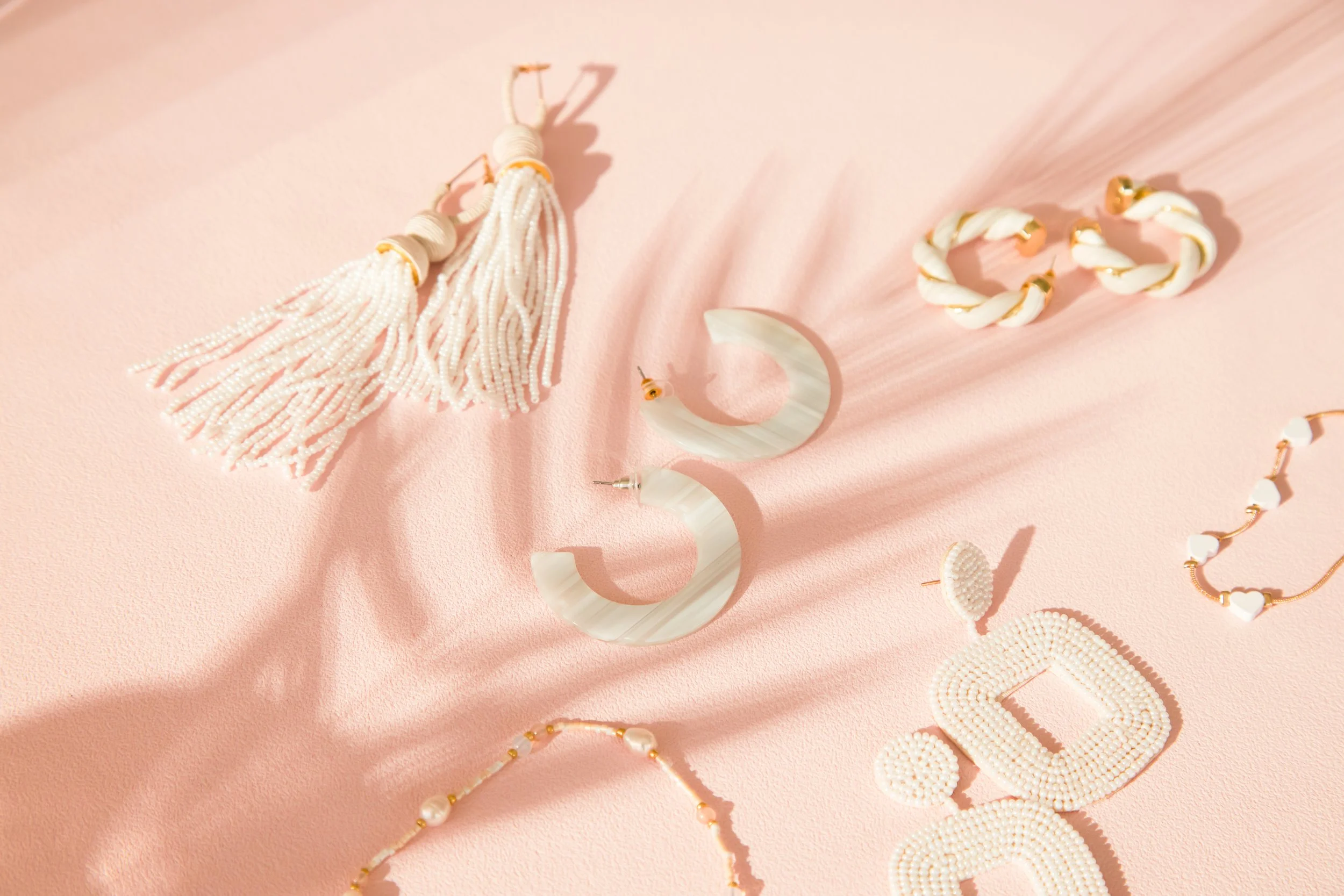 BIRDY GREY_HONEYMOON JEWELRY_HERO FLAT LAY_RT_02.jpg