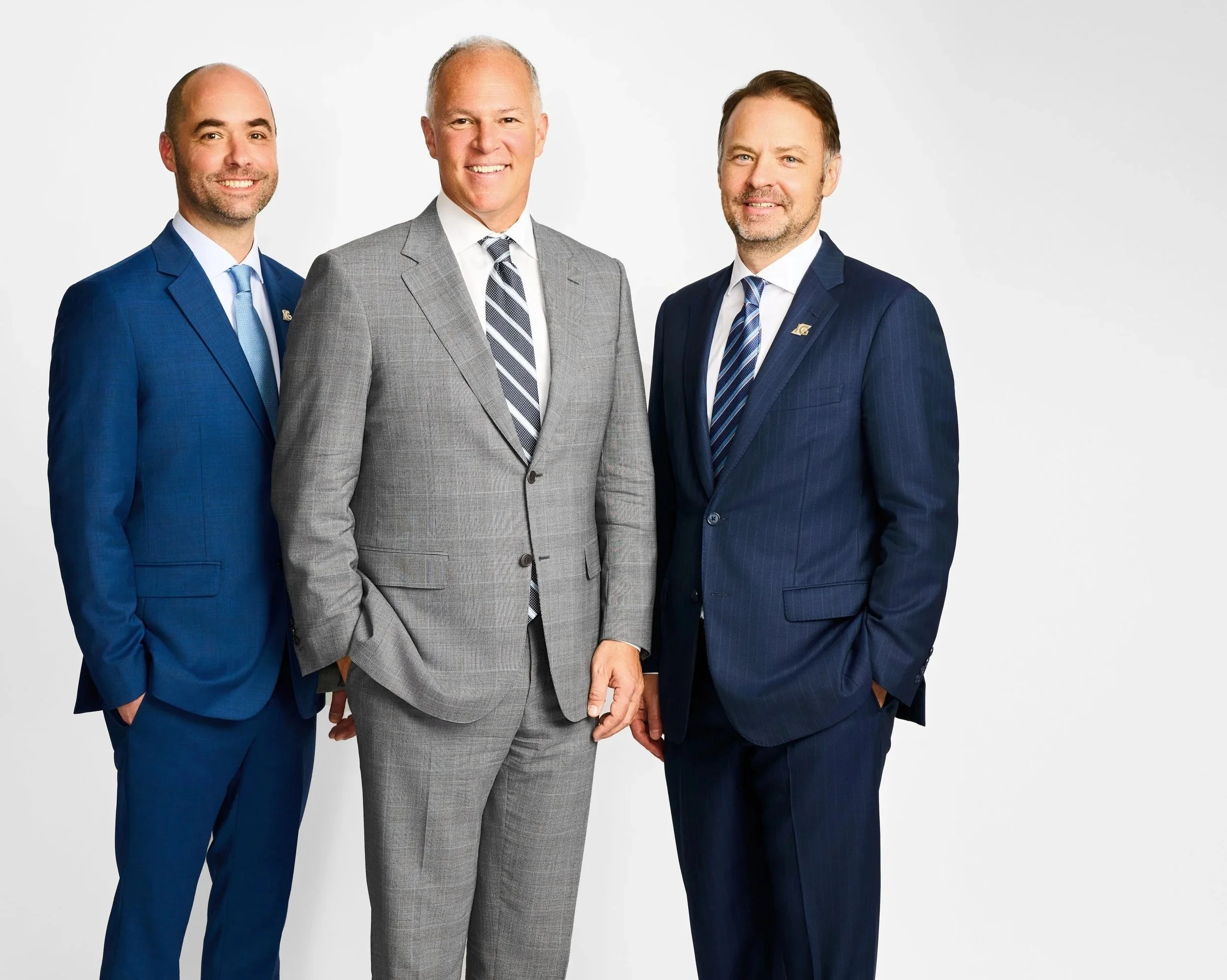 A professional group of three men in suits for a corporate team headshot session in Toronto.
